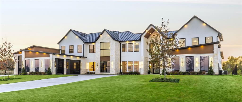 New listing 2026! Premimum lake lot, pinnacle luxury design, now offered under appraised value with over 8,000 sq ft, 8 car garage, elevator, AG exemption and builder's incentives. Setting the standard in multi-generational living in Bartonville’s luxury community of Eagle Ridge and masterfully constructed on the premier 2+ acre waterfront lot, bringing sophistication and elegance into everyday enjoyment throughout. Elevated lifestyle amenities are found throughout with exquisite finishes, beauty and function, featuring two 15 ft double kitchen islands wrapped in Taj Mahal and matching vent hood, expansive built-in Miele expresso coffee bar space, walk-in full working pantry with gorgeous floor to ceiling double entry iron and glass doors, an all iron and glass temp controlled wine room adjacent to the walk-in wet bar with Taj mahal counters, dual Wolf ranges, dual Sub-Zero fridges, and floor to ceiling storage cabinets. The private primary suite delivers the ultimate spa experience with a 15 ft steam shower and soaking tub, 16' stunning floating vanities with backlit mirrors, 2 remote commodes and the ultra luxury one-of-a-kind 2 story LED lit boutique-style closets where showcasing your fashion never looked more gorgeous. Elevating the home even further with convenient elevator, cinema seating theater with twinkling ceiling, two see-through 20ft tall stone fireplaces, floating staircase with glass and iron railing, pet grooming room, 40’ RV garage, 4 Tesla charging stations, marble glass finished epoxy garage flooring, infinity edge jacuzzi, covered veranda with outdoor grill and griddle, temp-controlled pebbletec pool with LED lighting, extra large sunken stone fire pit lounge area, faux turf and Control 4 system. Plan your own lake dock and fish for 10lb Trophy bass right out your back door. Zoned to exemplary Argyle ISD and close to Liberty Christian, Marty B's, golf and nearby lakes.