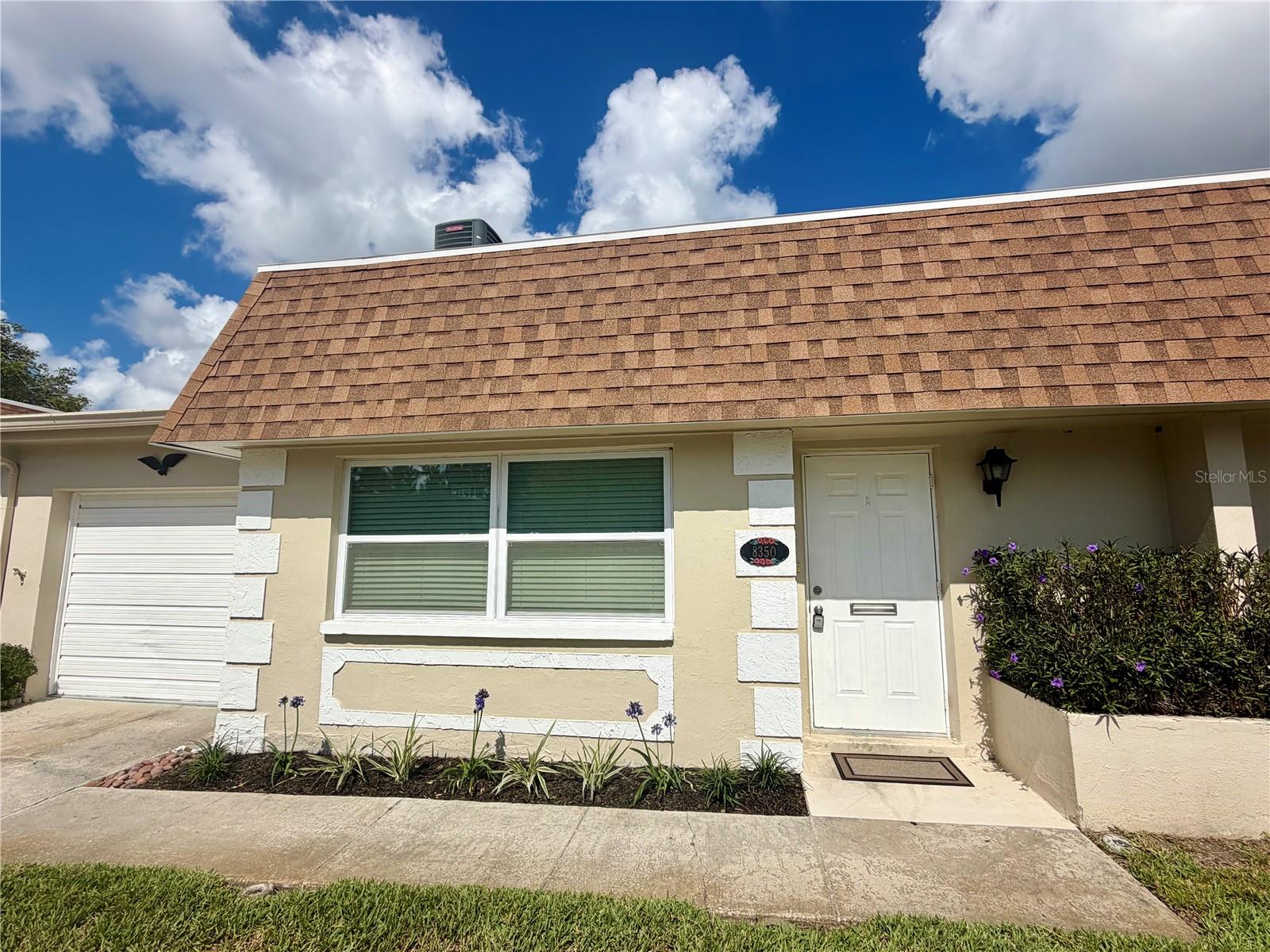 Vendome Village 55+ Community — Don’t settle for the rest, come see the BEST!Enjoy truly maintenance-free Florida living with water, sewer, trash, internet and cable included in the maintenance fees — everything but electricity! The fees also include roof maintenance and replacement, exterior and grounds maintenance, management, insurance, community amenities and much more.This beautifully updated, move-in-ready villa is fresh, clean and ready for its new owner. Many updates include New kitchen with Calcutta Quartz countertops and appliances, flooring, baths, newer windows and a new 2025 roof, with no prior flooding or hurricane damage.Tastefully redone with an impressive amount of storage, including a three-door bedroom closet, walk-in closet, linen closet, coat closet at the entry, plus your own ATTACHED GARAGE.Whether you’re looking for a sunny second home or your primary residence, this quaint villa has everything you need for easy Florida living. Vendome Village offers a clubhouse, pool and shuffleboard, all conveniently located near beaches, dining, shopping, Sam’s Club and Tampa International Airport.