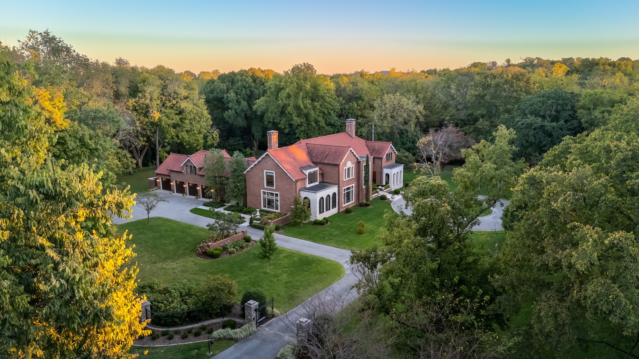 Extraordinary residence reminiscent of country homes from the previous century.   Stately and handsome home, designed by Ron Farris, Architect, with a focus on quality and superior, sourced materials.  Fenced and gated, the secure property is surrounded by mature landscaping designed by Anne Daigh.  Interior finish details, such as flooring of Belgian Bluestone and quarter-sawn oak and unique exterior components, from the stunning handmade brick laid in a Flemish bond pattern and reclaimed Ludowici clay barrel tile roof create an unbeatable combination.  An abundance of large custom windows flood the interiors with light, but it is the repetition of oversized case openings and romantic wide arches creating interior vistas that make memories.  Practical work spaces, lighting, geothermal heating/cooling and security systems utilizing up-to-the-moment technology combined with large airy public spaces and comfortable family areas. 4316 Franklin Pike provides the greatest luxury of all, peace of mind.  Additional acreage available, enabling ownership of an entire block of land along Franklin Pike.
