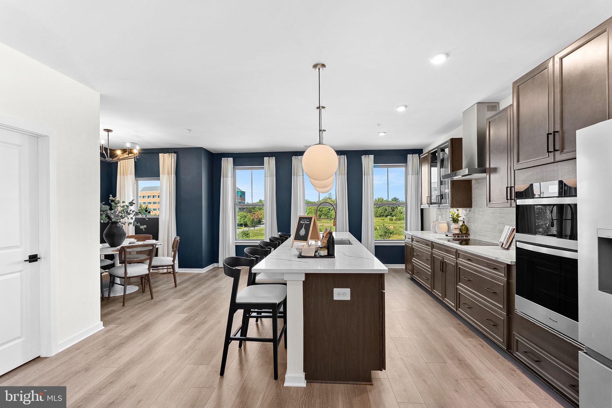 NEW CONSTRUCTION. BASE LISTING for Hepburn Floorplan. Get up to $25K in closing costs when using a Choice Lender until 8/31. Welcome to the Hepburn, a brand-new, upscale stacked townhome in the sought-after Belmont Park community in Ashburn, VA. This 2-level home with a 1-car garage is designed for convenience and style—perfect for those ready to move quickly! Featuring 3 bedrooms and 2.5 baths, this home boasts a modern kitchen with 42” cabinets, LED lighting, quartz countertops, and stainless-steel Whirlpool appliances. A generous kitchen island and covered deck invite connection. The spacious primary suite includes a generous walk-in closet and a luxury bathroom with raised double vanities and a walk-in spa shower. Plus, the garage comes equipped with an EV charger-compatible outlet for future-ready living. Enjoy low-maintenance living with snow removal, lawn care, and exterior upkeep all handled for you—giving you more time to enjoy life, not maintain it. Belmont Park offers resort-style amenities including bocce ball, volleyball, playgrounds, community greenspace, and more. Located in Ashburn, you’ll have quick access to major roadways, Dulles Airport, and endless dining and entertainment. Beazer Homes at Belmont Park are designed to live better day to day, with energy‑efficient construction that lowers monthly utility costs, thoughtful design options that make personalization simple, and Mortgage Choice, where our top lenders help you compare options and save money on your home loan. This high‑performance home is built to lower your total cost of homeownership through reduced utility bills, durable materials, and high‑quality construction that minimizes long‑term maintenance costs. Beazer Homes is proud to be America’s #1 Energy‑Efficient homebuilder. Hometown heroes get $2,500 (restrictions apply; see New Home Counselor for details). Our FY25 average gross HERS score of 32 (38 excluding solar) was the lowest of the publicly reported scores among the top 30 U.S. homebuilders by volume identified by Builder Magazine’s Top 100 List (based on 2025 total closings). Model Home Hours: Mon–Sun, 11 AM–6 PM. Use 19758 Misty Moss Square Ashburn, VA 20147 for GPS directions. Parking will be next to our Information Center trailer. Please go to the model home listed here first.