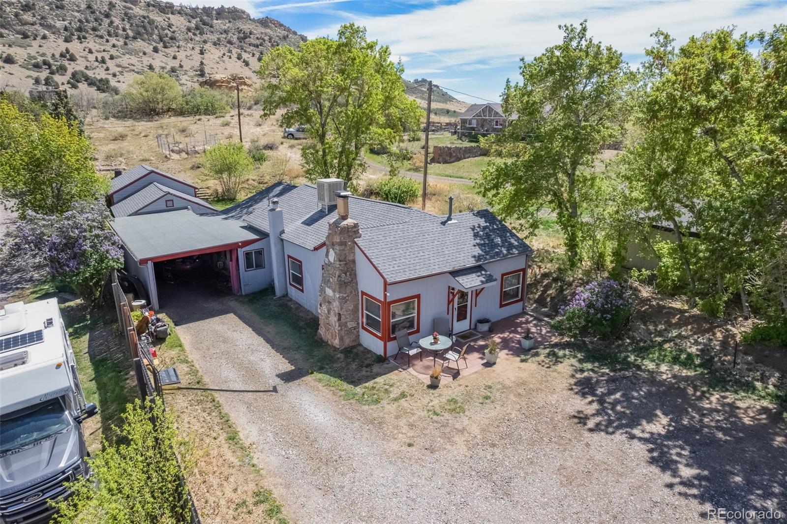 CHARMING FOOTHILLS PROPERTY on Just Over 1/2 Acre with Open Space Setting and Unmatched Access to Colorado’s Outdoor Lifestyle! Enjoy Beautiful Views of Mount Falcon Park from the Front Windows and Mount Glennon from the Back, Offering Stunning Colorado Scenery in Every Direction. Experience the Peace and Privacy of a Foothills Setting with Immediate Access to the Quaint Town of Morrison, World-Famous Red Rocks Amphitheater, and Bear Creek Lake Park. Convenient Access to C-470, I-70, 6th Ave, and Highway 285 Makes It Easy to Enjoy a Mountain Getaway or a Night Out in Denver. Property is Served by a High-Producing Well with Existing Pressure and Water Holding Tanks for Added Capacity, Plus an On-Demand Water Heating System. Fully Equipped Kitchen with Appliances Included, Along with Washer and Dryer. Multiple Workshop Areas Provide Excellent Space for Projects, Storage, or Hobbies, Ample Parking for Vehicles, Equipment, and Outdoor Gear.  Rare Opportunity to Own a Peaceful Foothills Retreat Where Privacy, Convenience, and Colorado Lifestyle Come Together!
