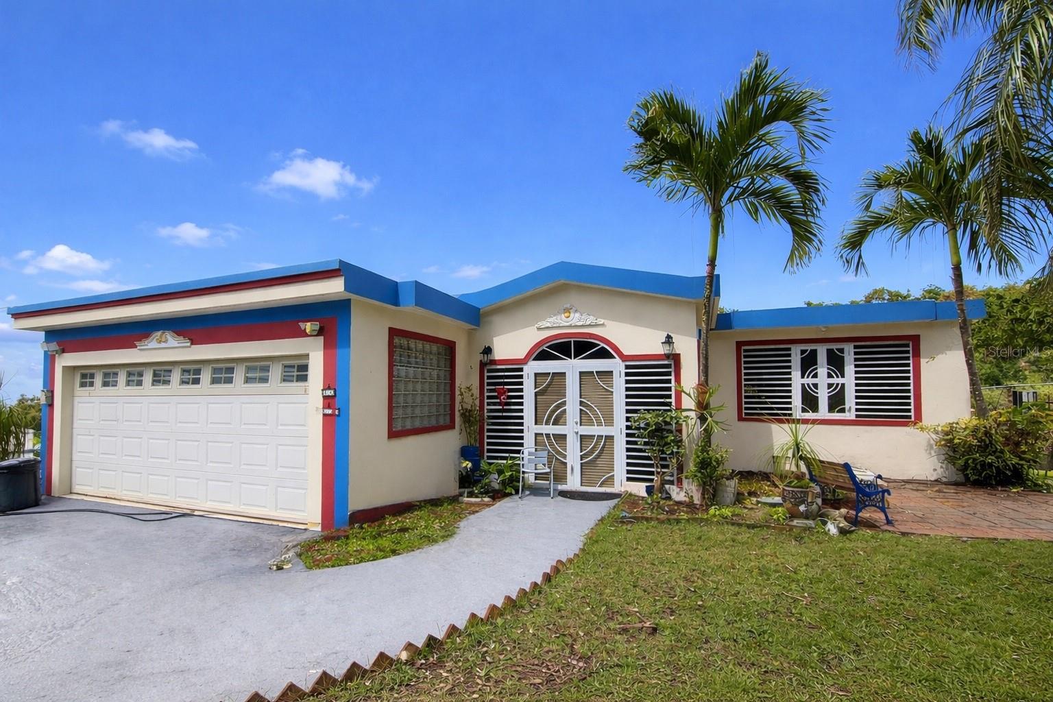 Spacious move-in ready residence in the Bayamón countryside. It has 2 levels distributed in 3 bedrooms, 2 bathrooms, living room, dining room, kitchen and, on the ground floor, study-office with a full bathroom. 2-car carport and additional parking space in the frontyard. Structure of 3,400 sf approx. of construction, on a .98 acres lot. Beautiful mountain views. It has an electric gate that gives access to the main entrance of the property and an independent side entrance with direct access to the study-office. Quiet community in the Buena Vista Ward, Algarrobo Road, 9.2 miles from the University of Puerto Rico-Bayamón Campus, and 5 miles from the Monte Frío Recreational Area, among others. FEMA: X (Low or moderate flood risk). Rating: R-G (Rural General). Annual Property Taxes: $1,665.87 approx. (without exemption; exonerated at the moment with payment of $228.86 annually). Property is sold as is.