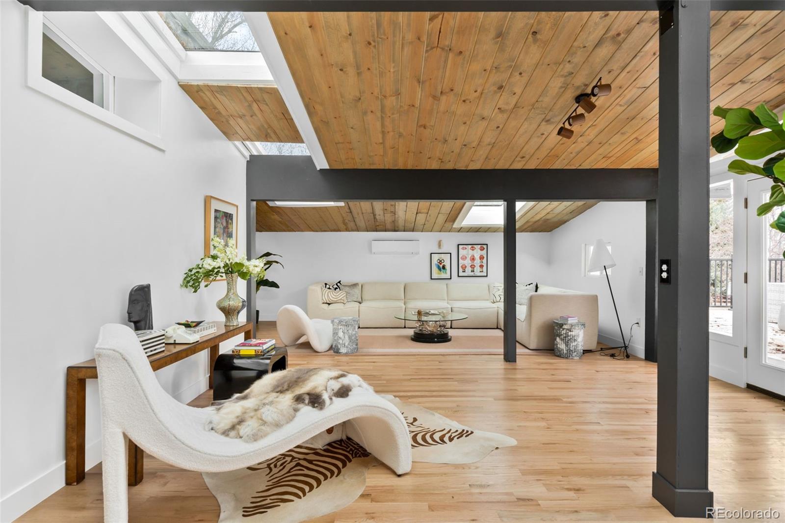 Welcome home to your Boulder oasis 10 minutes to downtown. Fully remodeled Mid Century Modern ranch. A beautiful 4 bedroom plus an office is waiting for you to bring it home for the holidays. The front living space is basking in natural light with tongue and groove vaulted ceilings, too many sky lights to count, and moss rock walls - it doesn't get more mid century than that! Just off the front living space is a rooftop deck offering beautiful views of the sunset over Longs Peak (yes! Mountain Views!). The kitchen is not to be missed with quartz counter tops, 36" gas range, and cabinets for days. You will love entertaining guests in your dining room over looking your nearly one acre lot, outfitted with a nano door to seamlessly blend the inside and outside. In the winter months make dinner cozy by firing up the wood burning fireplace. The rest of the main floor is dedicated to your primary suite and two guest bedrooms. The primary features double walk in closets and a period correct 4 piece primary bath. Two additional secondary bedrooms and shared hall bath round out the main floor. Heading downstairs to the basement you will find a huge flex space, big enough for a pool table and movie set up! Get cozy in this space too with the second wood burning fireplace. One additional bedroom and one office space occupies the basement along with the 3/4 bath and dedicated laundry room. Stepping outside into your own oasis you'll find tons of mature trees, a yard big enough to hose football games, pickle ball court, or both! On this nearly 1 acre lot the possibilities abound. Brand new septic and sewer line 2025, Roof replaced in 2024, new hvac, new well pump etc! Buyer and Buyer agent to verify any and all information used for advertising, and deemed important to them. Permits available on city/county website, all finals have passed, for Buyer and Buyer Agent to review. Square Footage measured by Licensed Appraiser.