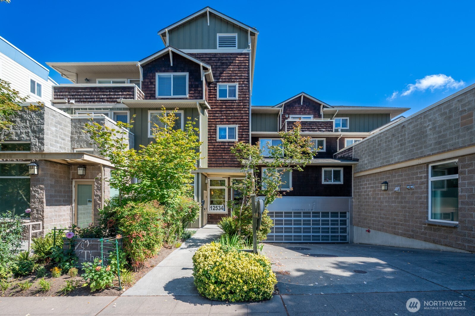 Top-floor corner unit with 2 beds, 1.75 baths, plus a bonus den — quietly tucked on the building's east side, away from street noise, with only one shared wall. Bright, open kitchen features a granite island and stainless steel appliances, complemented by LVP flooring throughout. The primary suite offers a double-vanity bath and a spacious walk-in closet. Shaded east and south exposure keeps the home naturally cool and comfortable year-round. Enjoy a large private balcony with outdoor storage, two tandem parking spaces in a secured garage, plus an additional indoor storage unit. Well-run HOA with strong reserves. Just a 16 minute walk (even faster via new protected bike lanes!) to the new Pinehurst light rail station, opening 9/30/2026. A rare top-floor find with comfort, quiet, and convenience.
