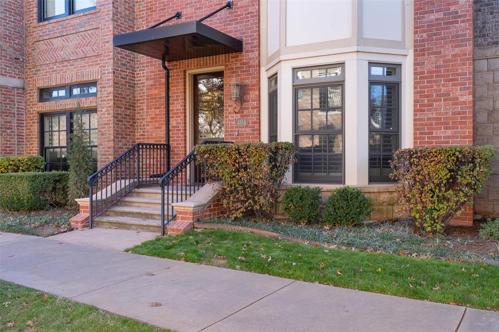 Located at 404 NE 1st Street, this beautifully designed 2-bedroom, 2.5-bath home offers modern style, energy efficiency, and an exceptional urban location in the heart of Oklahoma City.The main living area features rich hardwood floors, an open-concept layout, and soaring 10-foot ceilings with elegant crown molding, creating a bright and spacious atmosphere. A striking staircase with wood treads and iron railing adds architectural character, while a skylight brings in abundant natural light. 8-foot doors throughout enhance the home’s sense of scale and craftsmanship.The kitchen is thoughtfully appointed with granite countertops, a center island with seating, custom wood cabinetry, stainless steel appliances, and designer pendant lighting—ideal for both everyday living and entertaining.Additional highlights include geothermal heat and air for outstanding energy efficiency and a security system for added peace of mind.Conveniently located near Downtown OKC, Bricktown, Deep Deuce, and the OU Health Sciences Center, with easy access to Riversport Adventures, Scissortail Park, and Paycom Center, home of the Oklahoma City Thunder. Dining, entertainment, and major employment centers are all just minutes away.A rare opportunity to own a thoughtfully crafted home in one of Oklahoma City’s most connected and desirable urban neighborhoods.