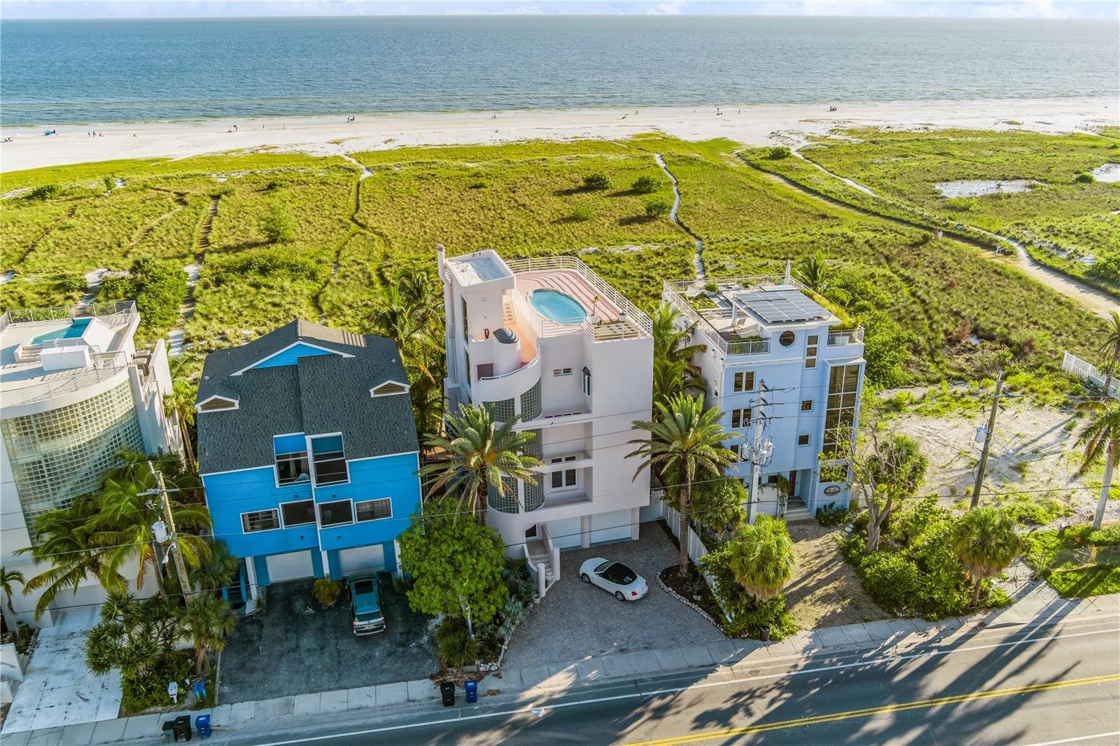 Welcome back to 648 Beach Road, you’ve seen it before, but it’s better than ever. Reconstructed, reimagined, and elevated in every detail, this extraordinary residence delivers the same breathtaking, front-row views you remember… with an entirely new feel that’s fresh, refined, and built for the way you live now. This expansive three-bedroom retreat lives like a private resort, with the space to convert to a five-bedroom, perfect for hosting, creating office space, or adding guest suites without sacrificing flow. Step outside to a wraparound terrace on every floor, designed for sunrise coffees, sunset cocktails, and everything in between, because when your backdrop is this spectacular, indoor/outdoor living isn’t a feature, it’s a lifestyle. Ride your private elevator to the top and discover the ultimate luxury: a private rooftop pool where the horizon becomes your daily view and the sky feels like it belongs to you. Add in a rare four-car garage, and you have a true coastal statement home, spacious, secure, and effortlessly impressive. 648 Beach Road isn’t just a comeback. It’s a glow-up, with the views you loved, and the home you’ve been waiting for.