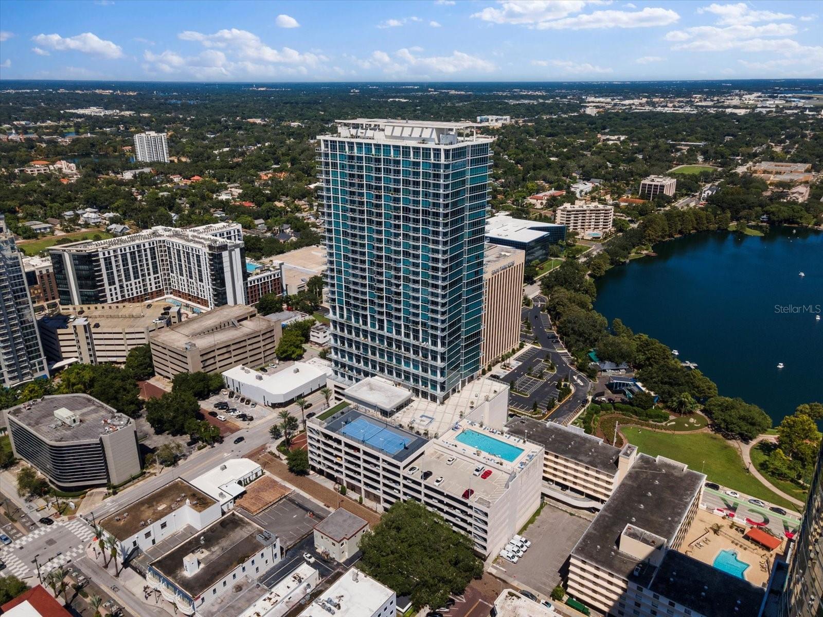 Sophisticated 1-Bedroom loft condo with Tranquil Lake Eola views and modern features at the VUE residences. Perched on the 14th floor, this meticulously designed unit combines modern elegance with comfort, making it the perfect urban retreat in the heart of Downtown Orlando.

Upon entering, you'll immediately notice the expansive windows that bathe the space in natural light and frame the serene views of Lake Eola and the surrounding city skyline. These peaceful vistas provide a calming atmosphere, ideal for unwinding after a busy day. Plus, the condo is equipped with electrical blinds, allowing you to effortlessly control the amount of sunlight and privacy at the touch of a button.

The open-concept living area flows seamlessly, featuring hardwood floors and a modern kitchen with stainless steel appliances, sleek cabinetry, and a spacious island—perfect for both cooking and entertaining. The open space offers the flexibility to design your living area to suit your lifestyle.

The master suite is a peaceful sanctuary, offering generous closet space and a relaxing ambiance that enhances the loft setting. For added convenience, the unit includes in-unit laundry.

The building offers an array of amenities, including a gorgeous pool, state-of-the-art fitness center, and 24-hour concierge service, allowing you to enjoy a resort-style living experience. Additionally, you'll be within walking distance to a wide range of dining, entertainment, parks, and cultural attractions that Downtown Orlando has to offer. Minutes from Dr.Phillips Performing Art Center, Kia Center, Orlando City Soccer Stadium and Camping World Stadium. 

Whether you're a first-time homebuyer, a professional looking for a chic urban lifestyle, or simply seeking a peaceful retreat with stunning views, this condo offers the best of both worlds—luxury and location.