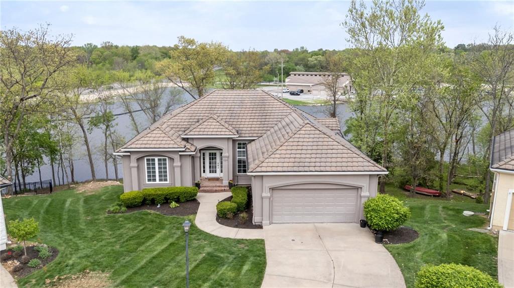 Completely updated.  This home offers the best of lake living without the hassle.  The Villa HOA takes care of lawn care, fertilization, lake fed sprinkler system, and leaf cleanup so you can spend more time enjoying everything the lake lifestyle has to offer.Natural light fills the home through expansive north-facing windows, perfectly framing stunning lake views.  The main level also features a spacious primary suite, second bedroom with it's own en suite bath--ideal for guests or in-laws--and convenient main floor laundry.The fully renovated kitchen is designed to impress with custom cabinetry, large island with seating, loads of storage, upgraded stainless steel appliances,  gas cooktop, quartzite countertops, and versatile space for casual dining or entertaining.The walkout lower level is built for hosting, complete with a full wet bar, refrigerator, sink with built in glass rinser.  There's ample room for recreation--pool and ping pong tables that are included--along with a comfortable space to relax and watch games, all while enjoying scene lake views from the covered deck.The outdoors includes a fire pit down by the waterside.  The Villas offer wonderful amenities as mentioned above as well as free use of pontoon boats, private covered docks allowed only to villa owners.Lake Winnebago also offers exceptional amenities including the yacht club, seasonal events and entertainment, indoor and outdoor gathering spaces, equestrian facilities, parks, tennis and pickleball courts, and scenic walking trails and a new resort-style pool with competition lanes.Owner agent.