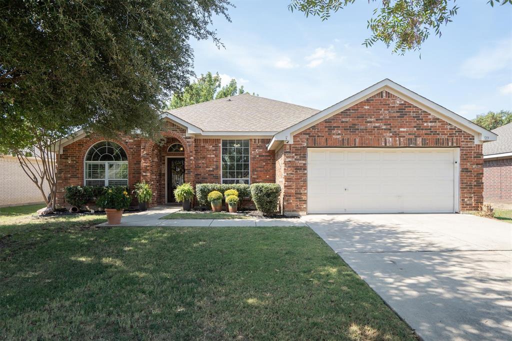 WELCOME HOME to this beautifully maintained single-story in the desirable Commons at Willow Creek subdivision! This 4-bedroom, 2-bath home features an open-concept layout designed for both comfortable living and effortless entertaining. The spacious primary suite is thoughtfully separated from the secondary bedrooms for added privacy, while two of the guest rooms include walk-in closets. A versatile floor plan allows the front dining area or fourth bedroom to easily serve as a home office, second living area, or wellness retreat. Well-appointed kitchen is designed for both function and flow, featuring generous breakfast bar seating and an open view into the spacious family room with its inviting wood-burning fireplace and adjoining dining area. Outdoors, a backyard fire pit creates the perfect setting for relaxing or entertaining with family and friends. All of this is set within Eagle Mountain–Saginaw ISD, just minutes from schools, shopping, restaurants, park, and right across the street from neighborhood amenity center including a community pool. This home truly checks all the boxes!