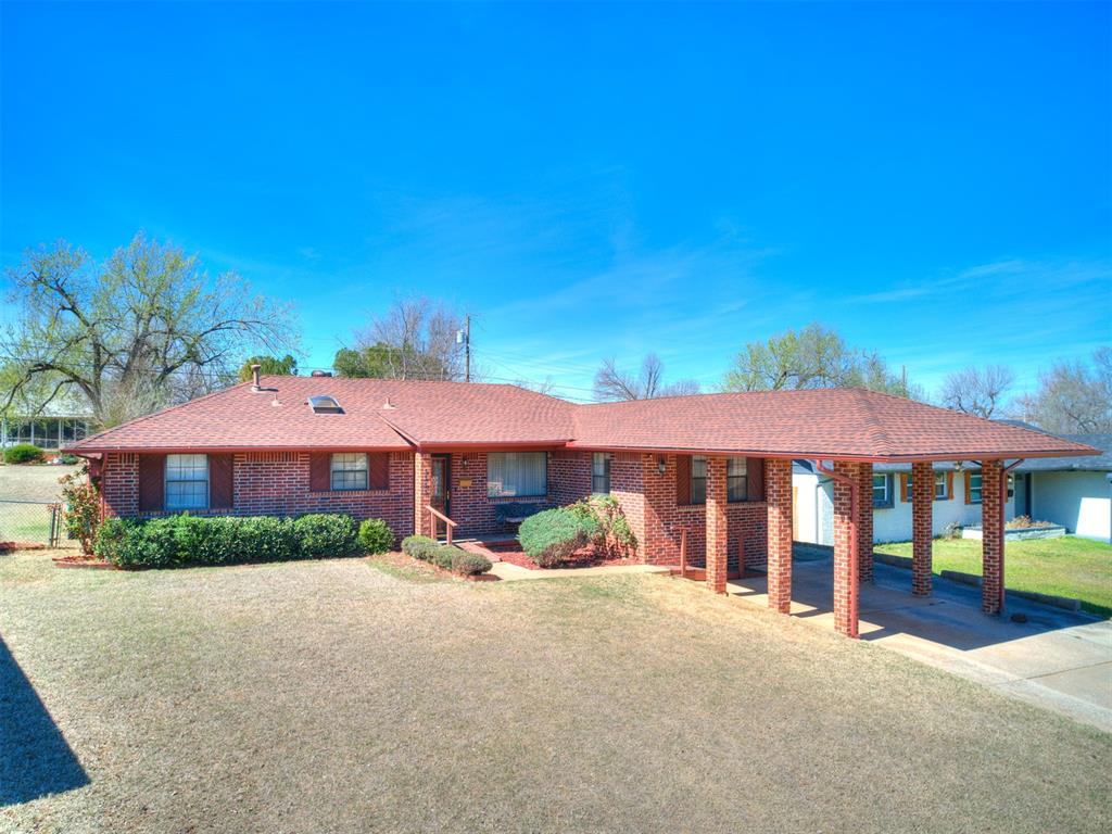 This neighborhood borders the Adventure District where all the fun is! 3 bed 2 bath home had quality remodel work in 1984 to increase the square footage to 1655 sq ft so now, this brick home with covered parking really stands out! From the leaded glass doors on, it’s straight up classic, mid-century style at it’s finest and it’s obvious that this is where the family will gather for holidays. There’s room for multiple cooks in a kitchen with wood, parquet style flooring, plenty of counterspace and cabinets, a pantry, 2 yr old Frigidaire appliances to include a dishwasher, double ovens, microwave, refrigerator, & cooktop with vent hood. More cooking can be done on the built-in gas grill near the covered patio while watching the kids expend some energy in the large, fenced yard. Gather where the natural light shines in through picture windows in both the formal living and dining area complete with chandelier. The main living area has a rock fireplace, beamed ceiling, skylight and sliding door to covered patio. Hall bath has jetted tub, double vanities, skylight & barn door. Main bedroom has bathroom with shower and walk in closet that sports a wall safe! The outbuilding stays with property. At this price, there's no hesitating to see it so bring your proof of funds or pre-approval letter & earnest money, and ask for a showing TODAY! *All info deemed to be correct. Buyer to verify.*