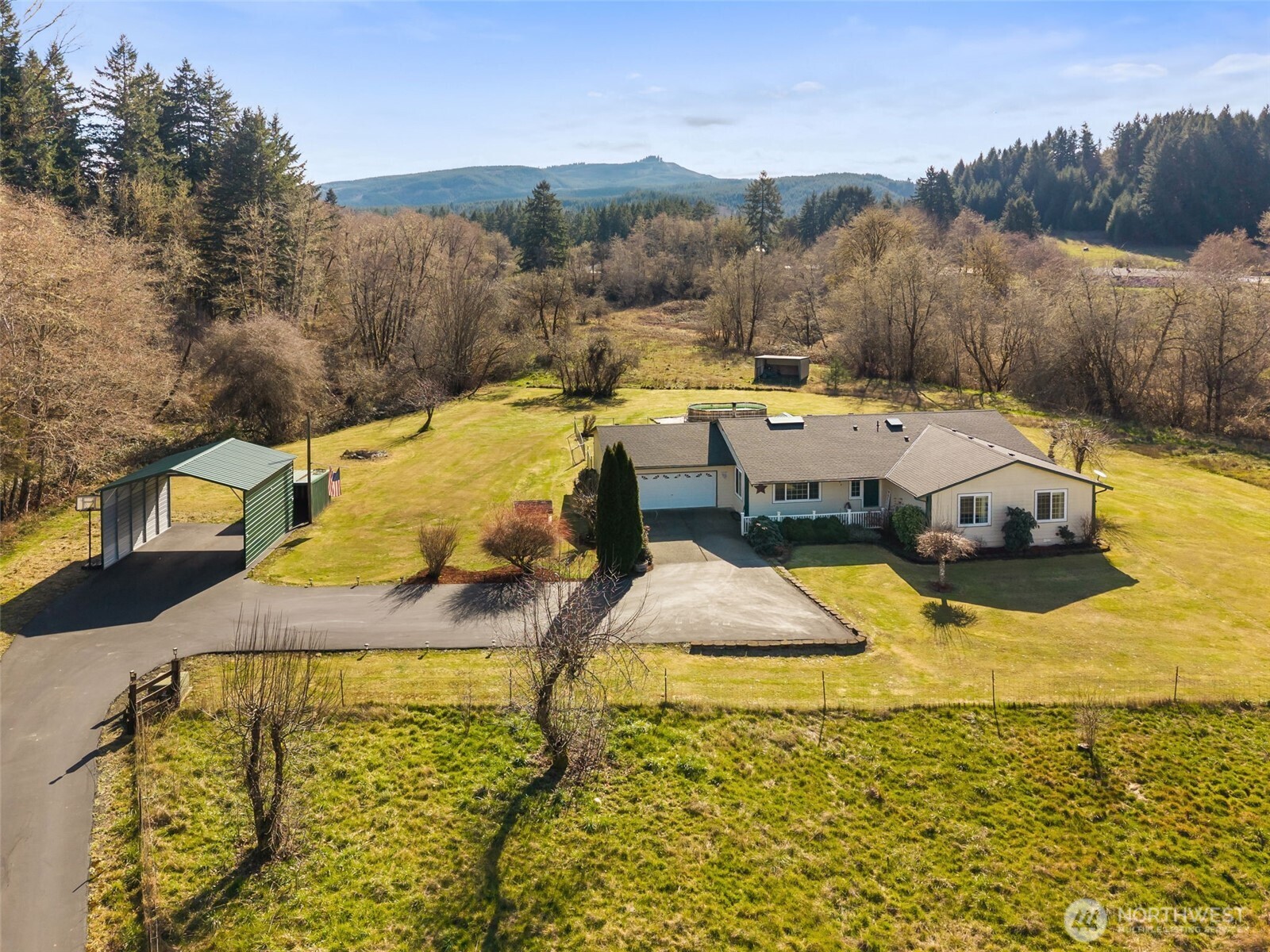 Set on 14+ acres across 2 parcels, this quiet equestrian property is surrounded by a creek and located just minutes from I-5. The second parcel has all utilities in place—ready for you to bring your expansion plans to life. Grounds are fully fenced and cross-fenced. Beautiful, upgraded 2,100+ sqft. open-concept home featuring vaulted ceilings, 3 bedrooms, 2 baths, and an office/den. Spacious living room with wood stove, kitchen with eating bar, dining room with slider to the covered patio with a hot tub. An attached 2-car garage, 2 car carport. Enjoy a private backyard featuring fruit trees, plus dog runs with kennels. The home is equipped with a heat pump and central A/C. Paved driveway provides easy access to the equestrian facilities, anchored by a 50x96 covered riding arena with LED lights and overhead sprinklers. Barn amenities include 7 matted stalls, 1 foaling stall, and a heated tack room with laundry. Also includes hay and shaving storage, covered RV and horse trailer parking. Truly an equestrian's dream. Schedule a private tour and explore everything this facility has to offer.