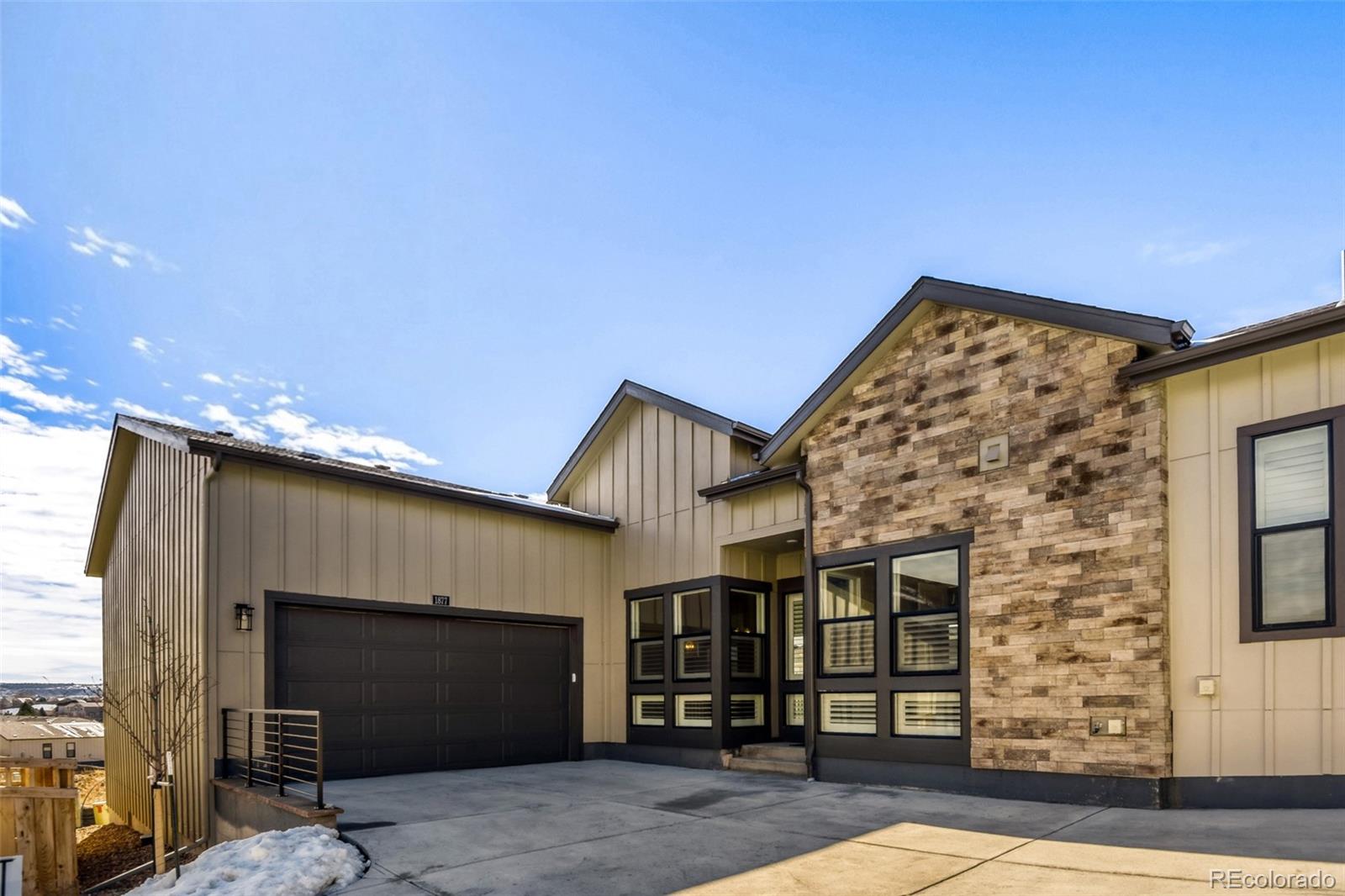 Why wait for new when this gorgeous ranch plan in Hillside at Castle Rock is ready NOW! This beautiful home features 2 bedrooms, 2.5 baths, great room, kitchen, main floor laundry, office, unfinished basement and 3 car garage. Meticulously maintained - pride of ownership shines through.  Beautiful upgrades throughout including under cabinet lighting in the kitchen, upgraded kitchen cabinetry, upgraded wood flooring, custom steel front security door; laundry room sink and cabinets; window shades on all windows at the back of the home plus custom shutters on the front windows.  Additional upgrades include pre-wire in the back bedroom for a ceiling fan / light, reinforced hook up in the living room for heavier lighting fixture, 8' doors, a gas stub on the back deck for a grill and more. The many windows allow the natural light to cascade in - bright and cheerful. Quick possession.  Finish the basement for even more living space. Buyer to assume the Simplisafe security system (the system is paid for but on a month to month service plan).Close to dining, shopping, entertainment and other amenities.  Don't miss your opportunity.  Welcome Home!