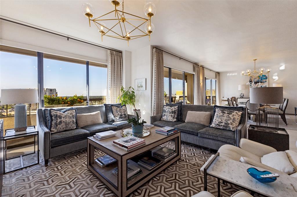 Elevated above Turtle Creek on the 22nd floor of The Warrington, this sophisticated residence offers sweeping views, expansive living spaces and a remarkable collection of amenities. Floor-to-ceiling windows fill the living and dining areas with natural light, while an expansive covered balcony provides a beautiful setting for outdoor dining and enjoying the views.The open living and dining areas feature marble flooring, elegant lighting and generous space for entertaining. The kitchen offers sleek cabinetry, natural stone countertops, a large island with seating, stainless steel appliances and a pantry. A separate media room with custom built-ins and an adjoining library provide additional spaces for relaxing or working from home.The spacious primary suite features a sitting area, balcony access, an ensuite bath with dual sinks and a walk-in closet. A second bedroom also offers balcony access and a private bath. Additional highlights include a powder bath, full-size laundry area, two assigned parking spaces and a separate storage unit.The Warrington offers concierge services, a fitness center, heated pool with swim jet, hot tub, outdoor fire pit, grilling area, tennis and pickleball court, two dog parks and a community room. HOA dues include water, sewer, trash, grounds and structural maintenance, management and use of community facilities.Enjoy a premier Turtle Creek location near the Katy Trail, Turtle Creek Park, Uptown, Highland Park Village, the Dallas Arts District and an exceptional selection of dining, shopping and entertainment.