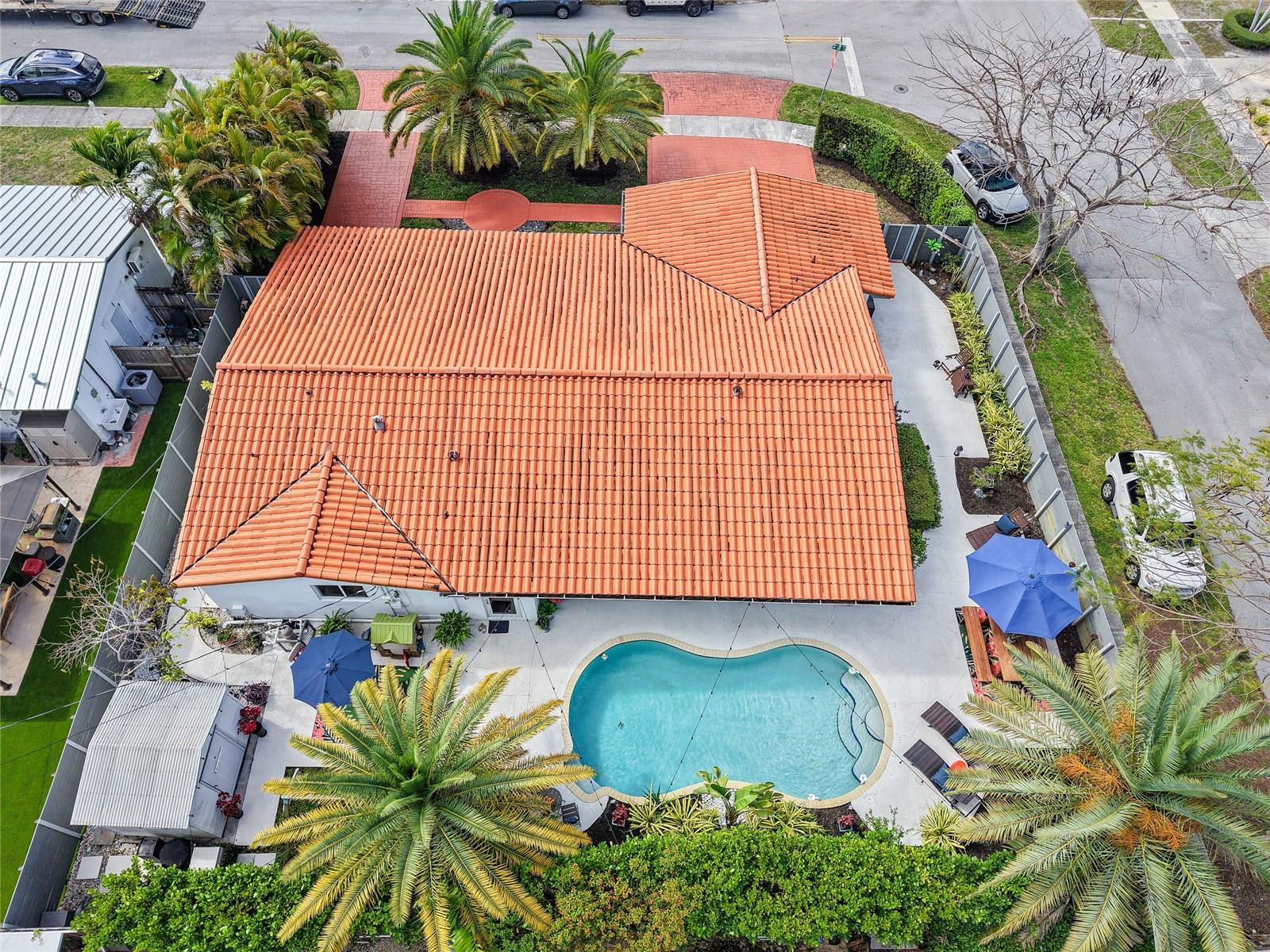 Nestled in the tranquil Darlington Manor neighborhood, this charming 5-bedroom, 3-bathroom pool home embodies the best of South Florida living. Situated on a desirable 8,700 sq. ft. corner lot, the property combines comfort, space, and functionality. The interior features elegant tile and engineered hardwood flooring throughout, complemented by abundant natural light. The spacious kitchen includes ample cabinet storage, stainless steel appliances, and a generous breakfast nook, conveniently located adjacent to the formal dining area, ideal for entertaining. Each bedroom is warm and inviting, while the primary suite stands out with a large walk-in closet and a private en-suite bathroom with dual vessel sinks and a frosted glass shower panel. Large windows provide beautiful views of the property, and a cozy terrace offers plenty of space for outdoor seating and relaxation. Ideally located in Miami, this home is just minutes from top restaurants, shopping, and major entertainment. A true must-see!