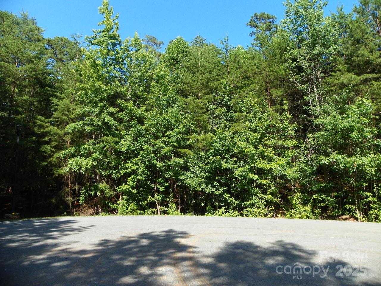 Take a look at this  1.35 Ac. lot- Private-no thru traffic! Located in beautiful Gated Heron Bay Subdivision on pristine
Badin Lake. Short distance to major Airports: Charlotte and Greensboro. Enjoy the community facilities.  Great Clubhouse with wonderful wraparound covered porch to relax on with that favorite beverage and enjoy the serenity of the lake.  (May reserve for personal functions)  Fenced storage facility for a small fee.  Parking just a cross the road from the Clubhouse with Pickle ball! Boat launch next to the Clubhouse.
Make this great lot yours and build that dream home OR Lake getaway!  Don't want to cook!! Restaurants on the lake for your convenience!   Give us a call and check out beautiful Heron Bay, might just be what you have been looking for!!  (Clark)