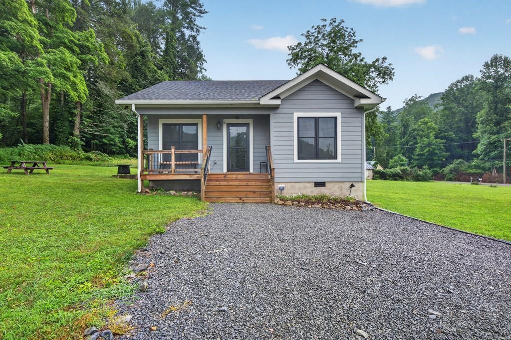 This thoughtfully designed cottage within the town limits of Damascus was completed in 2021 and offers quality craftsmanship, distinctive finishes, and an unbeatable location for outdoor enthusiasts!   From the moment you arrive, you'll appreciate that this isn't a typical new construction home. Every detail was carefully selected, from the quality materials to the unique design elements that give the home warmth, character, and a natural aesthetic.  This home is being sold fully furnished and is ready to enjoy immediately!  Whether you're searching for a low-maintenance full-time residence or the perfect mountain retreat, this property offers a lifestyle that's difficult to duplicate.  Set on a spacious, level lot, you'll have plenty of room to create the outdoor space you've always envisioned. Add a detached garage or workshop, cultivate a thriving garden, or simply enjoy the privacy and open space. This unique property adjoins the Jefferson National Forest, providing direct access to thousands of acres of protected public land right from your backyard.  Outdoor enthusiasts will love the location! The Appalachian Trail, Virginia Creeper Trail, Backbone Rock Recreation Area, and charming downtown Damascus are all just minutes away, offering endless opportunities for hiking, biking, trout fishing, kayaking, and exploring one of Virginia's most beloved mountain communities.  Inside, the home features 2 bedrooms and 1 luxurious bathroom, thoughtfully designed with comfort and style in mind. The efficient floor plan makes excellent use of every square foot while showcasing the custom finishes throughout.  Whether you're looking for a peaceful place to call home, a weekend escape to the mountains, or an investment opportunity, this property offers exceptional flexibility. Buyers may also explore the opportunity to apply for a Conditional Use Permit to operate the property as a short-term rental (Airbnb), subject to local approval.