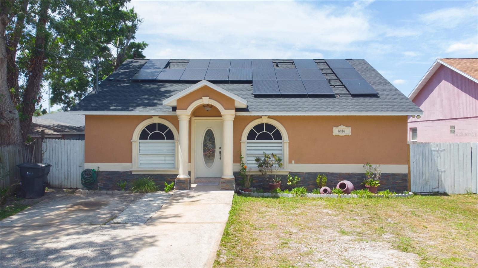 Great location with no HOA or CDD fees! This newer home offers 3 bedrooms and 2 bathrooms, featuring solar panels, a formal living room, and an open kitchen with an island that flows into the dining and family areas. The kitchen is equipped with stainless steel appliances, granite countertops, and a glass tile backsplash. The spacious primary suite is complemented by generously sized secondary bedrooms and a convenient indoor laundry room.Recent upgrades include a brand-new roof and newly added insulation, providing added efficiency and peace of mind. Enjoy a relaxing backyard with a covered rear porch, along with mango and avocado trees for your family to enjoy. Ideally located in the heart of Tampa, with easy access to I-275, the Veterans Expressway, Downtown, Midtown, West shore, International Plaza, Tampa International Airport, beaches, and more.