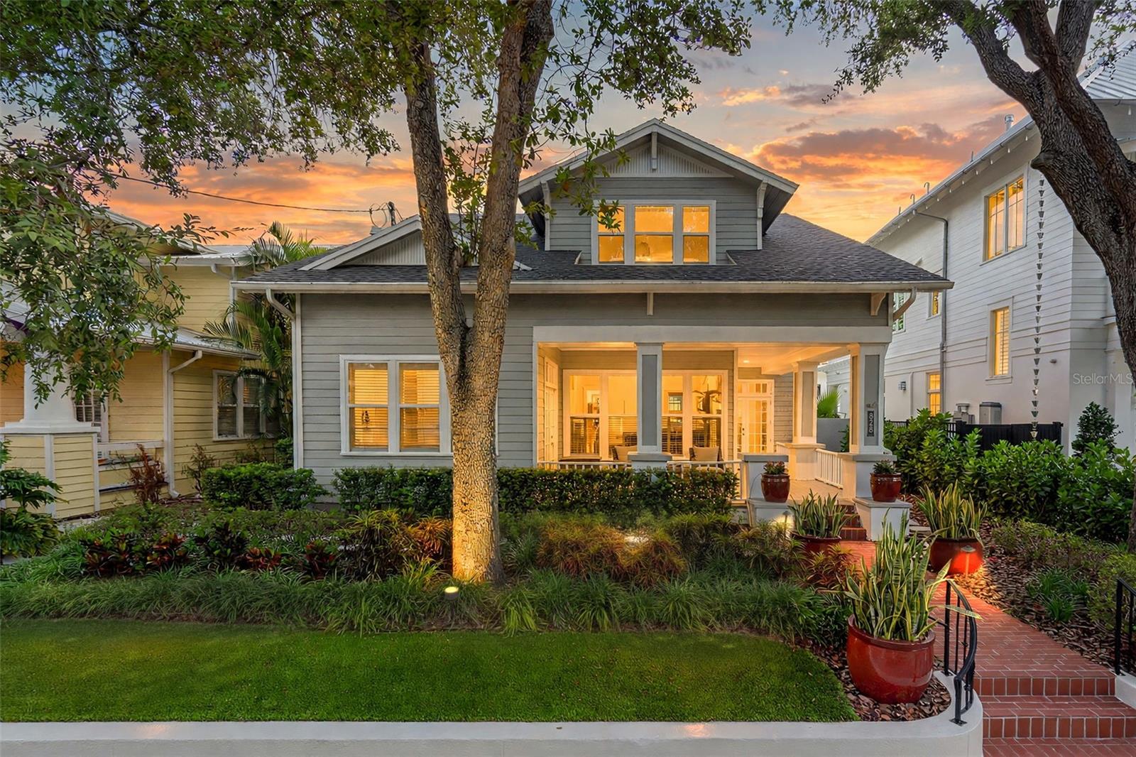 Under contract-accepting backup offers. New to market! Nestled under majestic oaks, in the heart of Hyde Park at the edge of Hyde Park Village and directly across from Kate Jackson Park, you’ll find this distinctive Craftsman-inspired residence that captures the enduring character and spirit of the area. Its wrap-around front porch provides a front-row seat to the neighborhood, with views of the park and the energy of one of Tampa’s most beloved residential settings. For families, the location is particularly compelling—park access, walkable streets, highly sought-after school zones (Grady/Coleman/Plant), and exceptional neighborhood amenities are all woven into daily life. Just minutes away, iconic Bayshore Boulevard stretches along Hillsborough Bay, providing miles of waterfront scenery and recreation via one of the country’s longest continuous sidewalks. When it’s time to dine, shop, or meet friends, Hyde Park Village is virtually at your doorstep. Its curated collection of restaurants, boutiques, fitness, and everyday conveniences makes it easy to enjoy the best of South Tampa without getting in the car. Downtown Tampa, Tampa International Airport, major interstates, world-class healthcare, and entertainment are all only minutes away.  Built in 1989, the 2,854-square-foot home sits high and dry in Flood Zone X and presents an appealing blend of recent construction with classic Craftsman architectural style and character. The inviting interior unfolds through open living and dining spaces that culminate in banks of French doors, creating a seamless connection front to back, where you’ll find the travertine patio, pool, and idyllic backyard. The result is a home equally suited to elegant entertaining and relaxed daily living. At the center is a beautiful chef’s kitchen, totally renovated in 2025. Updates include a professional-grade Thermador gas range, exhaust hood, wine cooler, Sub-Zero refrigerator, shaker cabinetry, quartz countertops, tile backsplash, butler pantry, and eat-in space. New wood flooring completes the look throughout the kitchen, foyer, and dining room. A flexible 1st-floor office/den/4th-bedroom space has its own access from the front porch as well as inside, providing versatility for a home office, guest space, or additional bedroom. Upstairs, the expansive primary suite features a generous bedroom with private balcony overlooking the pool, large walk-in closet, and spa-like bathroom with garden tub, separate shower, dual sinks, vanity area, and private water closet. Two additional second-floor bedrooms share a Jack-and-Jill bath. Outside, vine-covered masonry walls, professional landscaping, travertine pavers, outdoor lighting, and turf grass create a private, low-maintenance garden oasis that frames a resort-style heated saltwater pool and spa.  Steps away there's a screened side porch as a great alternative outdoor space and a detached two-car garage with rear alley access provides additional parking and storage. Other improvements include two NEW AC SYSTEMS (2024), NEW ROOF, NEW WATER HEATER, and NEW WOOD FLOORING in the kitchen, dining area, and foyer—all in 2025. Additional features include a whole-house water filtration system and irrigation system. Truly an address of distinction, with the best of Hyde Park at your doorstep—top-rated schools, a beloved neighborhood park, the Bayshore, Hyde Park Village, and a private backyard retreat. It’s a home that delivers a lifestyle, not just a nice place to live.