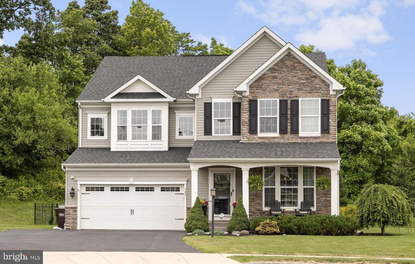 Welcome to 109 Heatherwood Court, an exceptional residence nestled on a premium cul-de-sac lot in the sought-after Hanover Pointe community in New Hanover Township. Built in 2018 with nearly $200,000 in builder upgrades, this stunning home offers approximately 4,690 square feet of beautifully finished living space, 4 bedrooms, 4.5 bathrooms, and an ideal blend of luxury, comfort, and functionality.  Situated on a private, fenced lot backing to mature trees with no neighbor on one side, this property offers a rare level of privacy and tranquility. A charming covered front porch welcomes you inside to a dramatic foyer featuring a decorative tray ceiling, rich maple hardwood flooring, and extensive recessed lighting throughout the main level.  The elegant formal living room and adjoining dining room create the perfect setting for entertaining. Both spaces are enhanced with crown molding, while the dining room also features classic wainscoting for added sophistication. The heart of the home is the spectacular gourmet kitchen, thoughtfully designed with an oversized center island featuring a breakfast bar and stainless steel sink, granite countertops, complementary tile backsplash, double wall ovens, gas cooking, abundant cabinetry, and a serving station with additional storage.  The under cabinet lighting is a nice touch!  A huge walk-in pantry and well-appointed mudroom with built-in bench seating, hooks, and an additional coat closet provide everyday convenience.  The kitchen flows seamlessly into the spacious family room, highlighted by a gas fireplace framed by modern wainscoting and accent lighting, creating a warm and inviting atmosphere. Just beyond, the bright Morning Room boasts a cathedral ceiling, walls of windows overlooking the backyard, and direct access to the composite deck, perfect for indoor-outdoor living and entertaining.  The finished lower level is truly impressive, offering exceptional versatility and recreation space. Designed for entertaining, it features a stylish wet bar complete with sink, cabinetry, granite countertops, and tile backsplash. The expansive layout includes a media area, game space, two fitness or flex areas, a full bathroom, and a large unfinished storage room that could easily serve as a workshop or future finished space. An egress window adds functionality and peace of mind.  Upstairs, a loft area at the top of the staircase serves as a comfortable sitting room and television lounge. The luxurious owner's suite is a private retreat featuring a tray ceiling, separate sitting area, two walk-in closets, and a bath with dual vanities, a private water closet, and a spacious walk-in shower. An additional bedroom is a Princess Suite that includes its own private full bathroom, while the remaining bedrooms are generously sized with excellent closet space and ceiling fans throughout. The hall bathroom offers dual sinks and a tub/shower with tile surround. A convenient second-floor laundry room completes the upper level. This home is equipped with a Gaudian Security System that the buyer can choose to continue by purchasing the App.  Combining elegant finishes, thoughtful upgrades, generous living spaces, and an exceptional private setting, this remarkable Hanover Pointe residence presents a rare opportunity to own one of the community's most desirable homes.  Bonus community features include a playground and walking path!!