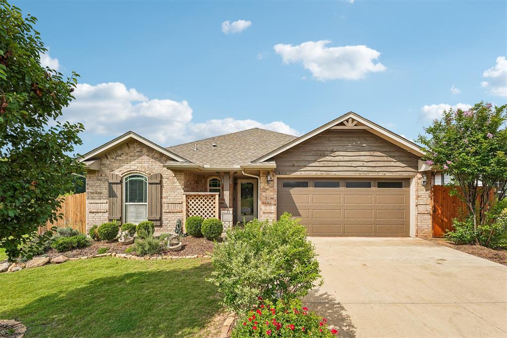 Tucked into one of Norman's coziest neighborhoods, this thoughtfully upgraded home offers a rare combination of premium features and an exceptional homesite. Situated on an approximately quarter-acre lot with maintained common areas beside, in front of, and behind the property, you'll enjoy added privacy, open views, and breathing room that's hard to find in a traditional subdivision setting.Inside, the home is built for both comfort and efficiency. R-44 blown attic insulation and R-15 wall insulation work alongside a fully insulated garage with its own dedicated HVAC system to keep energy costs in check year-round. The main living area features a cozy fireplace, granite countertops, and a Samsung stainless steel appliance package including a five-burner gas range. The primary suite offers two walk-in closets, and window blinds are included throughout.The garage stands out with stained floors, windowed garage doors that bring in natural light, and cedar exterior accent details that carry through to the home's curb appeal. Great for an "at home gym"! Out back, a fully fenced yard with cedar fencing hand stained by the seller and wrought iron gates includes an oversized 11-foot rear access gate, a full sprinkler system, a spacious covered outdoor living area, and an in-ground storm shelter. The enhanced front garden package and full guttering system round out a truly move-in-ready package.Community amenities include a brand-new neighborhood park and convenient access to shopping, dining, schools, The University of Oklahoma, and major Norman employers.