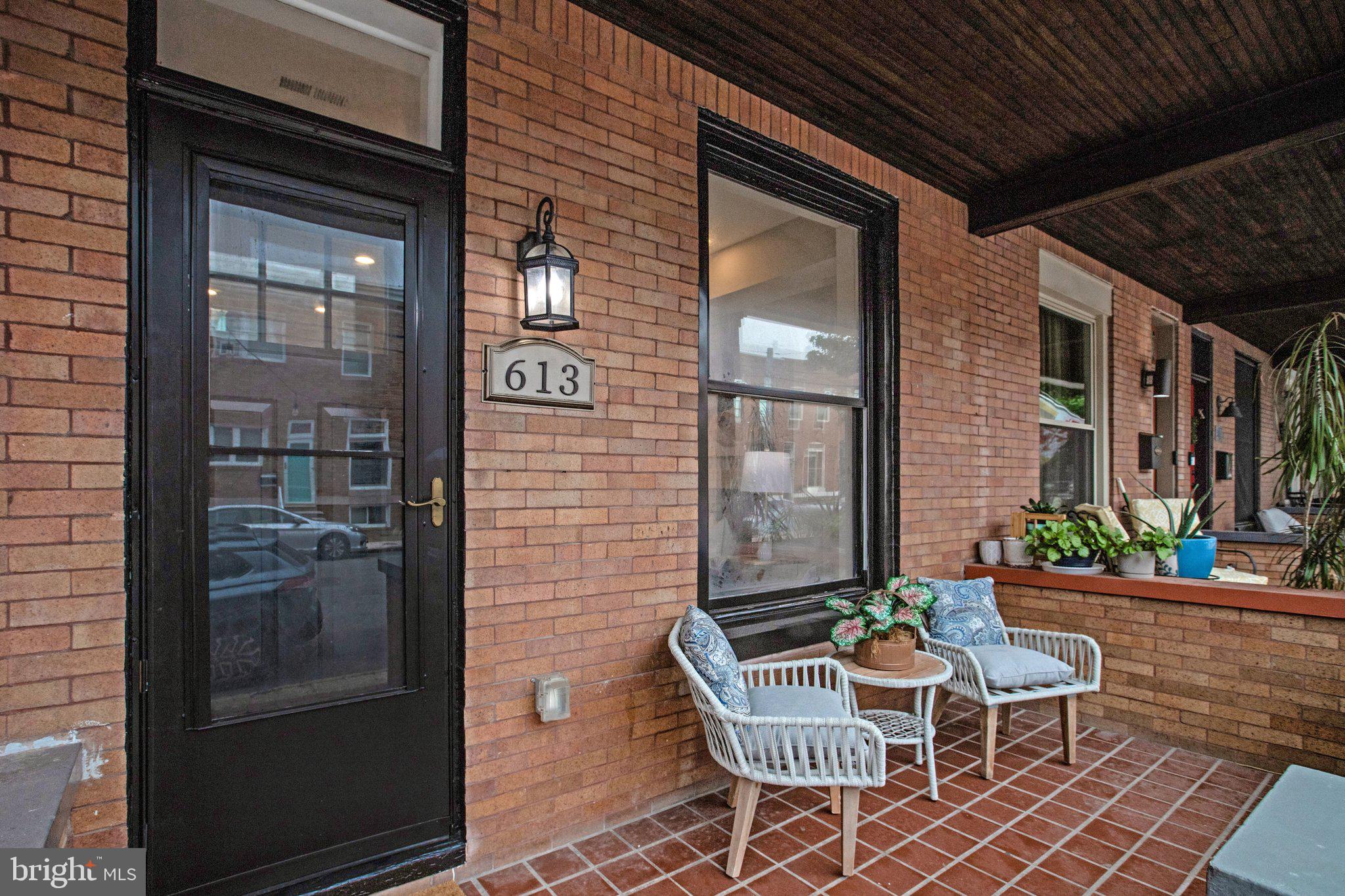 Welcome to this stunning contemporary rowhome in the heart of Baltimore's highly sought-after Brewers Hill neighborhood, where modern design meets everyday functionality. Striking black-trim windows create exceptional curb appeal, while the beautifully designed interior showcases an elegant chef's kitchen featuring all-new cabinetry, marble-look quartz countertops, and a timeless, sophisticated aesthetic.Designed with both comfort and flexibility in mind, this home offers a full bathroom for every bedroom, plus a convenient powder room on the main level. The fully finished walkout basement includes a kitchenette, making it an ideal space for extended family, guests, a private home office, or potential supplemental rental income.Step outside to one of the home's most coveted features—a fully finished solid wood rooftop deck with breathtaking panoramic views of the Baltimore skyline. Whether you're entertaining friends or enjoying a quiet evening under the stars, this outdoor retreat is sure to impress.Rounding out this exceptional property is the rare convenience of off-street parking for two vehicles. Located just moments from Brewers Hill's popular restaurants, shopping, parks, and easy commuter routes, this home offers the perfect combination of luxury, versatility, and city living.