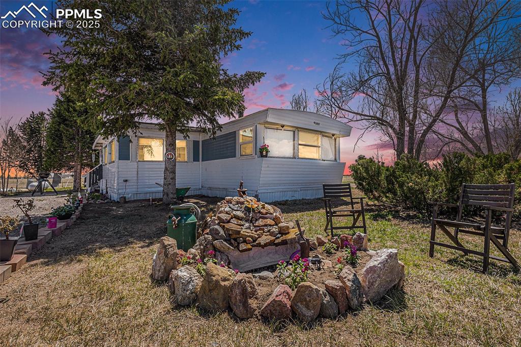 Welcome to this charming ranch-style home situated on a tranquil 5.01-acre lot in Peyton, Colorado! This 3-bedroom, 2-bathroom residence offers plenty of comfortable living space, complemented by more room in the unfinished basement that is ready for your touch! This property features a large living room area with an open kitchen that has more than enough cabinet space and room to entertain guests. There is a spacious primary bedroom on the main level along with 2 additional bedrooms and 2 full bathrooms. The versatile workshop area inside the home is ideal for hobbies or additional storage. Additionally, a separate shed/workshop on the property provides even more space for projects or equipment. Main level laundry with a utility sink for added convenience. With no HOA, this property offers the freedom to enjoy country living at its best! Enjoy the mountain views from the back yard while you drink your coffee every morning! Whether you're seeking a peaceful retreat or a place to build your dream home, this property offers endless possibilities. Don't miss the opportunity to own this slice of Colorado paradise!