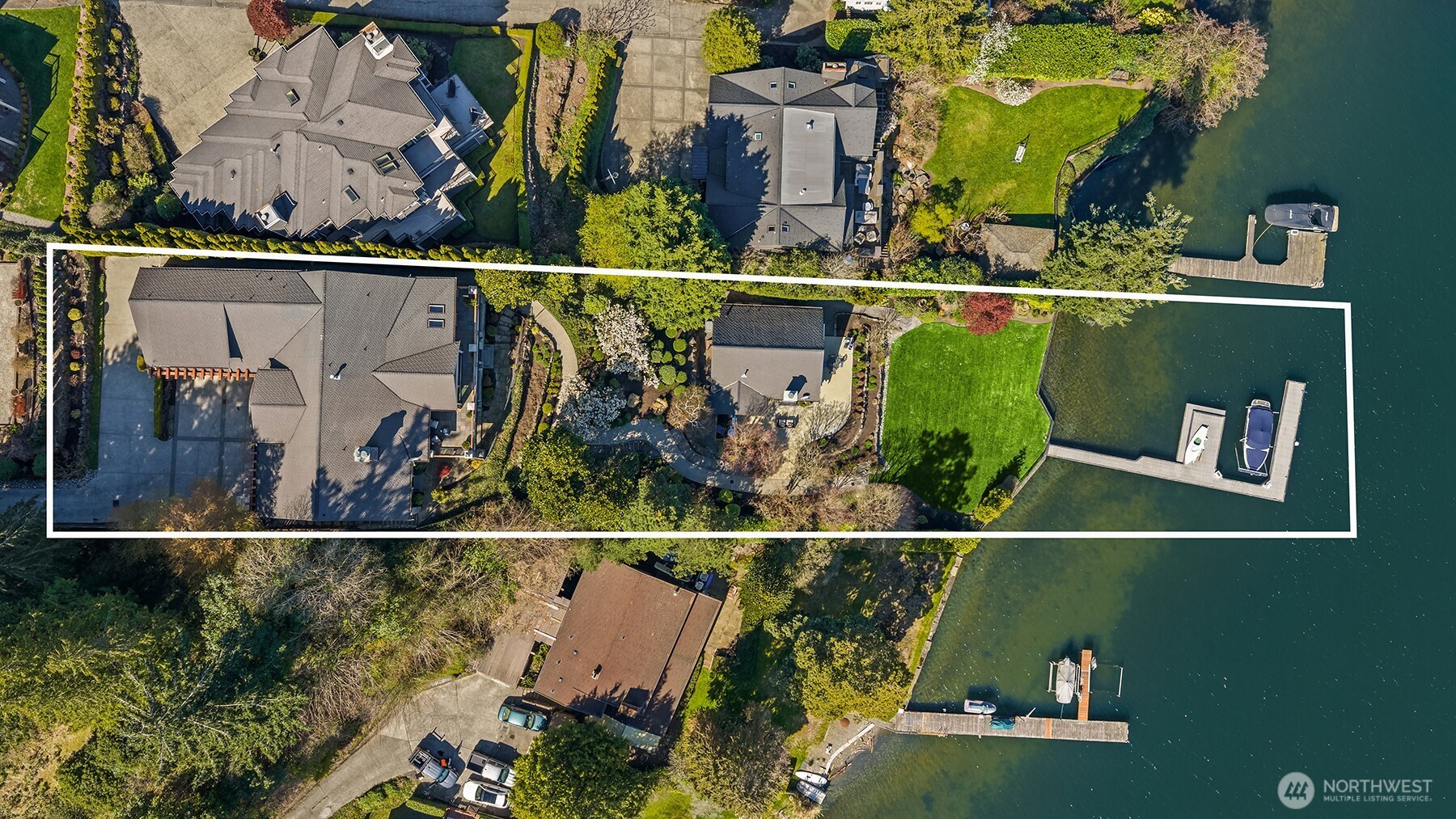 Set on a generous 1/2-acre parcel with 90 feet of commanding waterfront, this property delivers scale, privacy and undeniable presence.