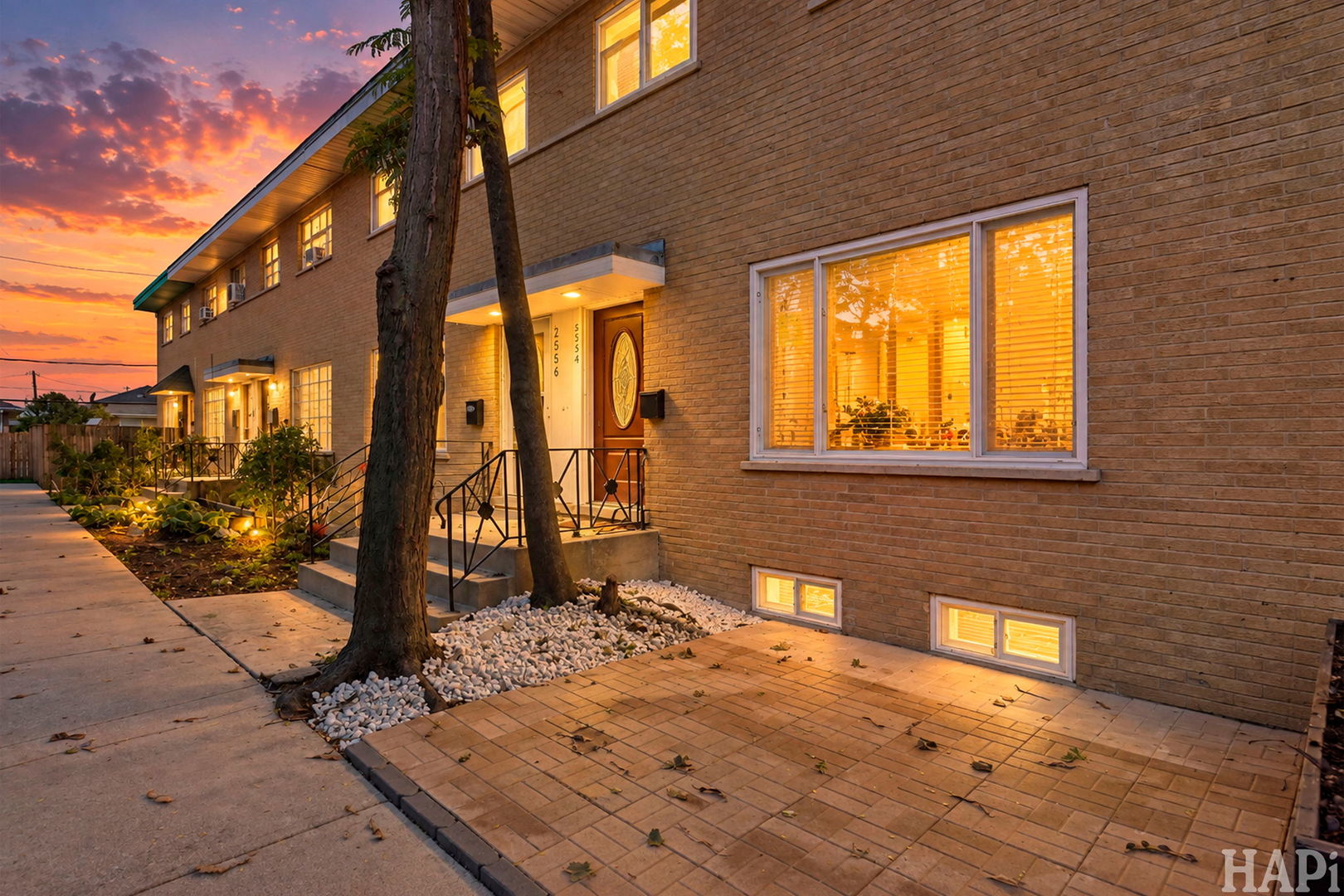 Completely renovated from top to bottom, this beautiful 3-bedroom, 1.5-bath townhouse with a full finished basement is truly move-in ready! Step inside to a bright and inviting open-concept layout featuring a brand-new kitchen with stylish cabinetry, stainless steel appliances and beautiful quartz countertops. A spacious living room is creating a wonderful space for everyday living and entertaining. Hardwood floors throughout. A convenient half bath completes the main level. Upstairs, you'll find three spacious bedrooms and a beautifully updated full bathroom with a tub.  The full finished basement provides additional living space. A separate laundry room for added convenience. No detail was overlooked, with extensive updates including a brand-new roof, brand-new windows, new A/C, furnace and water heater, updated electrical and plumbing, and a brand-new front deck. Enjoy plenty of parking, including 2 assigned parking spaces. Best of all-no HOA fees! Conveniently located near schools, parks, shopping, dining, and transportation. Nothing to do but move in and enjoy! A wonderful opportunity for both homeowners and investors.