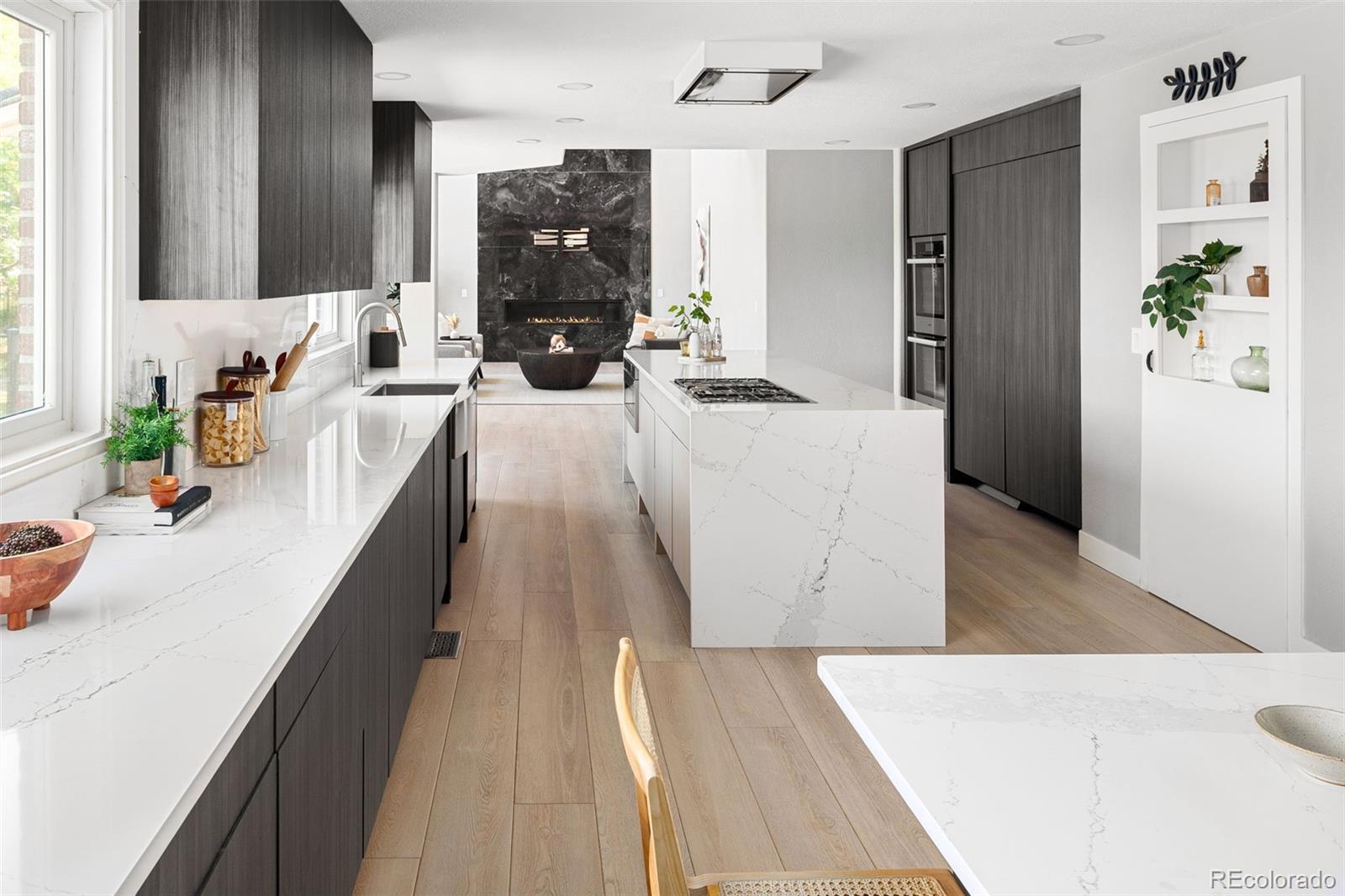 NOW PRICED TO SELL! Experience unparalleled luxury and sophistication in this exquisitely updated 5-bedroom, 5-bath residence, perfectly positioned on a private, fully fenced 1.16-acre estate. Revel in breathtaking sunrise views from your southeast-facing deck, where serenity and elegance meet.No detail has been overlooked in the thoughtful renovations, starting with the relocation of the laundry room upstairs for effortless convenience near the primary suite. A newly expanded second foyer off the garage offers a grand, welcoming space for everyday ease. The heart of the home—an extraordinary kitchen—is a true showpiece, featuring waterfall edge countertops, premium Miele appliances, and an oversized walk-in pantry complete with a freezer and water cooler.A curated, ultra-modern lighting package graces the home, enhancing the dramatic living room where soaring ceilings and floor-to-ceiling stonework frame a striking fireplace. A private home office with custom built-ins offers a perfect retreat for work or study.Upstairs, four beautifully appointed bedrooms—including a luxurious primary suite—showcase sleek, contemporary finishes that harmonize with the home's overall modern aesthetic.The fully finished, walk-out basement is an entertainer’s dream. Thoughtfully designed with theater seating for eight. In addition, swiveling chairs will allow you to delight in a cocktail, or a movie with one smooth motion. Dedicated arts and crafts area and generous lounge space—all updated to the highest standards of comfort and style— make this space ideal for unforgettable gatherings.This truly turn-key offering, an estate which blends cutting-edge design with refined comfort, promises an extraordinary living experience. Don't miss the opportunity to experience elevated living—schedule your private tour today and see first hand.