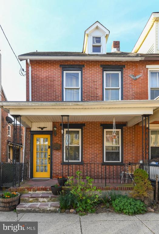 Historic 1890 three-story brick row home full of charm and character! This beautiful home features 3 bedrooms and 1.5 baths, both of which have been newly renovated. The large eat-in kitchen offers white cabinetry, a center island, and ceramic tile flooring—perfect for everyday living and entertaining.Enjoy a formal dining room and a spacious living room, both enhanced with elegant crown molding. Hardwood floors run throughout the home, adding warmth and timeless appeal.Additional highlights include a full unfinished basement with sump pump and drainage system, newer HVAC, and a fenced-in backyard ideal for outdoor enjoyment. Conveniently located near shopping and dining.  Make your appointment today!