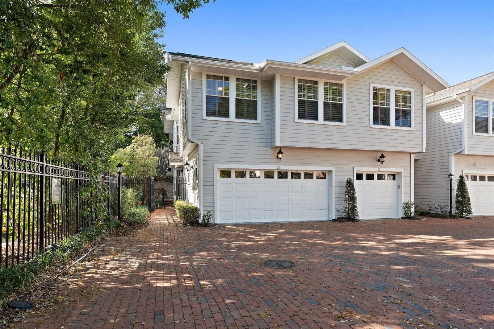 Perfectly positioned in sought-after South Tampa, just a block from the iconic waterfront of Bayshore Boulevard, this bright and inviting end-unit condo that lives like a townhome offers comfort, privacy, and an unbeatable location. Tucked within a gated community, the home welcomes you with a private landscaped entrance that leads to an open and airy interior featuring beautiful wood flooring and elegant crown molding throughout. A charming dining nook highlighted by a bay window and tray ceiling creates a warm space for meals, while the white kitchen shines with granite countertops, stainless-steel appliances, a gas cooktop, and a pantry. The kitchen flows effortlessly into the spacious family room, where a cozy gas fireplace and French doors open to a private deck—an ideal spot for morning coffee, evening stargazing, or simply enjoying Florida’s beautiful weather. A convenient half bath and direct access to the two-car garage complete the main level. Upstairs, the generous primary suite offers a peaceful retreat with a walk-in closet and a spa-inspired ensuite bath featuring a walk-in shower and abundant storage. Additional bedrooms are spacious and bright, sharing a well-appointed hall bath with a tub/shower combination, while a conveniently located laundry closet adds everyday ease. With a sparkling community pool and its desirable South Tampa location near shopping, dining, recreation, and airports, this home offers the perfect balance of relaxed living and urban convenience.