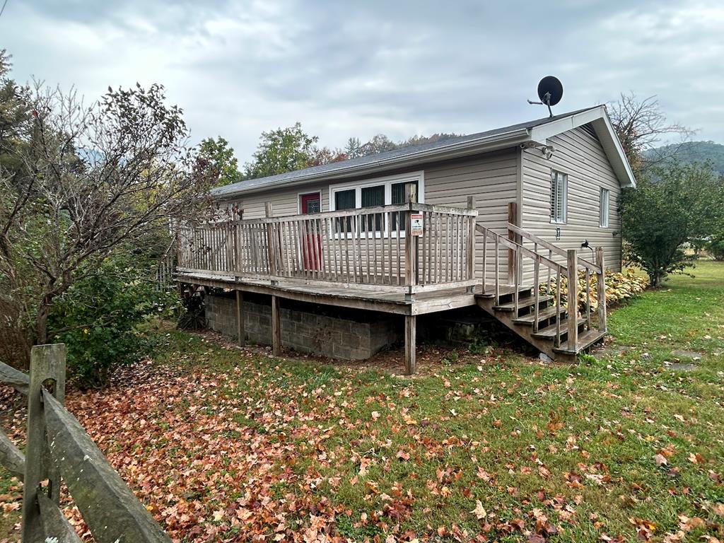 This move in ready ranch style home sits on 2 separate lots totaling a spacious .91 ac.  House lot has a fenced yard and the other lot has its own public water and septic with both joining Laurel Creek. Perfect for outdoor lovers or anyone seeking a peaceful setting.  Inside you will find 3 bedrooms, 1.5 baths, large kitchen and living room. Main bath has been modernized, kitchen has lots of counter space and the full basement is great for a workshop or storage. You have plenty of room for gardening, outdoor entertaining or just relaxing by the creek. Conveniently located of Interstate in a country setting.