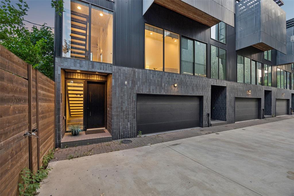Enjoy jaw dropping views of the Dallas skyline from the expansive rooftop deck of this modern townhome by AIA award-winning architect Josh Nimmo!  Built by Cobalt Homes, this architecturally stunning and sophisticated corner contemporary townhome is a 4-level urban oasis and entertainer’s paradise w private outdoor living spaces. Beautifully designed to maximize privacy, the unique architectural interior offers an open floor plan with clean lined modern finishes, bright open spaces, abundant windows providing natural light, power window shades for privacy, 10-foot ceilings, floating steel staircases, concrete & white oak hardwood flooring and quartz counters. The spacious kitchen features a large island w waterfall edge, walls of storage, Bosch stainless appliances, open to the living area w built in speakers and two dining areas. Dry bar features wine cooler. Ideal floorplan has 3 spacious bedrooms, each with ensuite baths, sleek quartz finishes and closets, plus half-bath for guests. Primary bath features stunning ensuite spa bath w rainfall shower in wet room for relaxation. Private 2-car attached garage.  NO HOA!