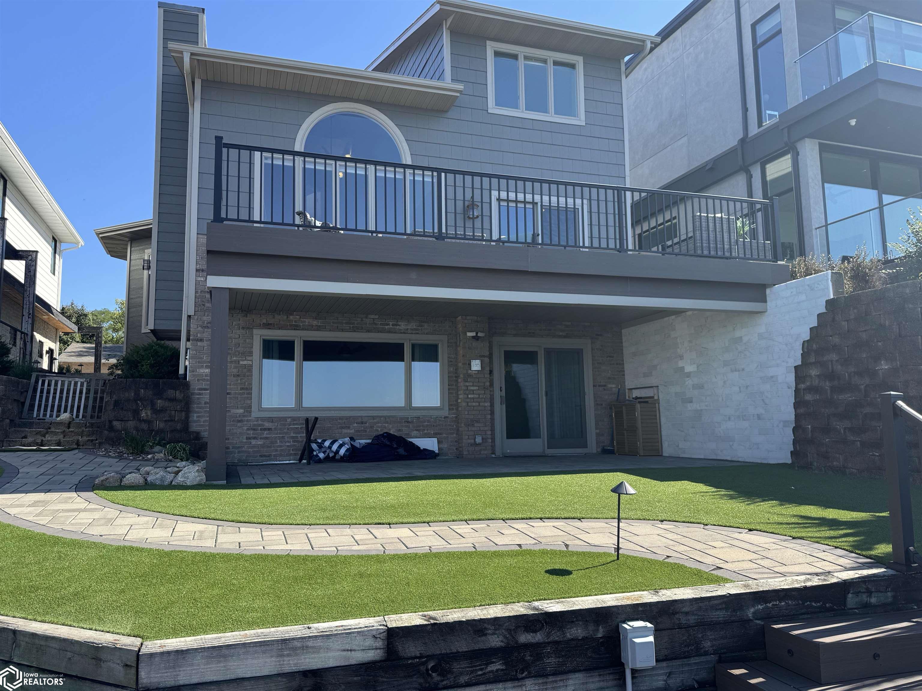 STUNNING LAKE VIEWS create the perfect back drop for entertaining in style!  Don't miss your opportunity to own this waterfront home for $250,000 BELOW assessed value!  Vaulted ceilings lend an open feel to the main floor.  The second floor contains a generous lakeside primary suite, two additional bedrooms and another full bath.  The lower level boasts a wet-bar, bath with a spa-worthy shower and flex space for an additional family room, or a great place to park your guests.  Just through the lower level siders you'll find a covered patio, greenspace and over 750 square feet of multi level decking.  There's a place for everyone.  Call today and come for a tour.