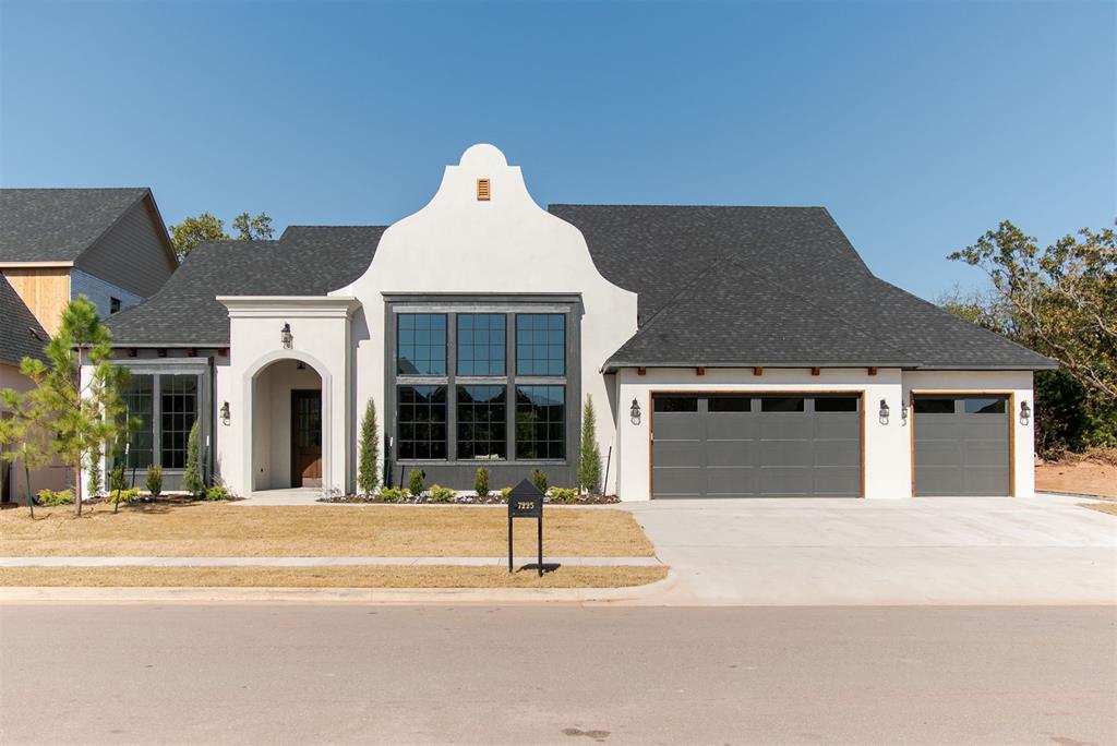 Welcome to a stunning Cape Dutch–inspired home that perfectly blends timeless architecture with elevated, designer finishes.From the moment you arrive, the home makes a statement with its distinctive exterior, complemented by natural accents and thoughtfully curated details. Inside, a dramatic wall of windows at the front of the home fills the space with natural light, creating a bright and inviting first impression.This 4-bedroom layout is both functional and flexible, featuring a private primary suite, a secondary en-suite bedroom, and two additional bedrooms separated by a hall bath. Rich hardwood flooring flows through the front bedroom (making it a great office), en-suite, and primary suite, adding warmth and continuity to the home’s design.At the heart of the home, the kitchen is a true showpiece—complete with GE Cafe appliances, a butler’s pantry, and carefully selected hardware that perfectly complements the appliance finishes for a cohesive, high-end look. The backsplash spans across the entire back wall adding durability and a beautiful design. The overall design of this home strikes a beautiful balance between light and airy spaces and rich, moody tones, creating depth and character throughout.The living area is anchored by a striking floor-to-ceiling stucco fireplace, offering both texture and a sophisticated focal point.Step outside to a backyard framed by a line of trees, providing a sense of privacy and a serene natural backdrop—ideal for relaxing or entertaining.You will find a storm shelter in the garage for added safety. Every detail of this home has been intentionally designed to create a one-of-a-kind living experience that feels both refined and inviting. Cottage Grove offers wooded walking trails, a pond with a beautiful fountain, and a playground. You are only minutes from Crest, Sams, restaurants, shopping, and more!