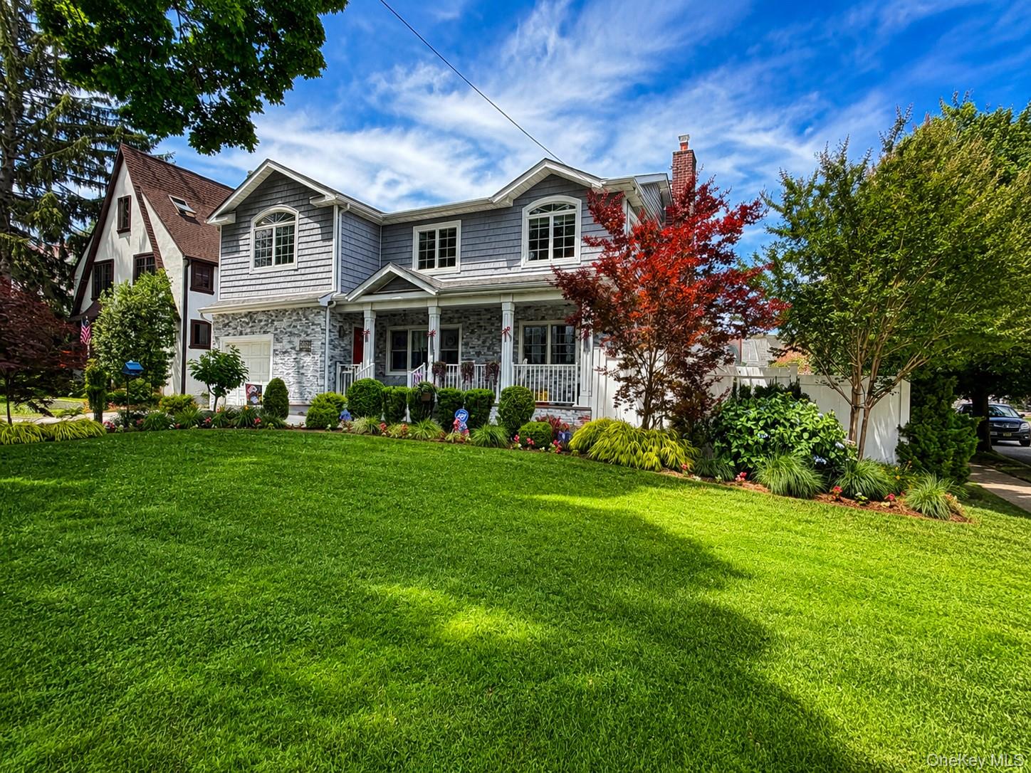 Welcome to this beautifully built 2019 Colonial, ideally situated on a picturesque tree-lined street in the heart of Bayside. Offering 5 large bedrooms and 4 full bathrooms, this thoughtfully designed home provides exceptional space, comfort, and flexibility.The main level features an open concept living space, first-floor bedroom and full bath, offering a versatile layout for guests, a home office, or other living arrangements. New kitchen with quartz countertops and tons of storage await your arrival.  And, a main floor laundry room complete the first floor providing everything you need for easy, convenient living.Hardwood floors extend throughout the home, complemented by generous closet space and abundant natural light.The finished basement includes a full bathroom and two separate exits, a 2nd washer/dryer and a kitchenette providing additional flexible living space to suit a variety of needs.Set on an oversized, professionally landscaped property, the backyard is designed for both relaxation and entertaining. Enjoy a three-year-old heated saltwater pool surrounded by mature landscaping, creating a private outdoor retreat.Conveniently located near the shopping, dining, and entertainment of Bay Terrace and Bell Boulevard, this home also offers easy access to the Long Island Rail Road, local bus lines, major roadways, parks, and highly regarded district 26 public schools.A rare opportunity to own a newer construction home in one of Bayside’s most desirable neighborhoods.  Just pack your bags and move right in!