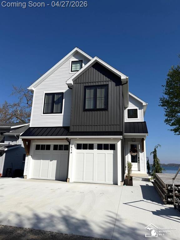 Experience lakefront living at its finest on all-sports Devils Lake! Positioned in a premier location, this stunning 2025 new construction offers the ideal blend of luxury, comfort, and breathtaking views! Step inside to a bright, open-concept layout filled with natural light and expansive windows that showcase the beauty of the lake. The designer kitchen is built for entertaining, featuring quartz countertops, soft-close cabinetry, and an oversized island. The spacious primary suite is a true retreat, complete with a private balcony, a walk-in closet, and spa-like ensuite with an oversized tiled walk-in shower. Enjoy outdoor living on the large concrete patio. Additional highlights include a 2-car garage with durable epoxy flooring, reverse osmosis system, and a whole-house generator for added peace of mind. Loaded with upgrades, this is lake living done right!