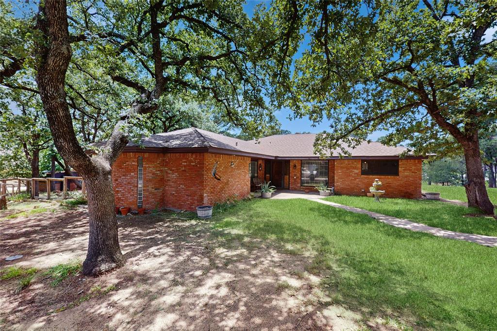 Three bedroom, two bath, three car garage, with bonus multipurpose building, nestled within the secluded Timbercreek Acres of Lewisville, TX.  Home sits on just over half an acre with many mature shade trees, the occasional fox, roadrunner, and beautiful peacocks adding to the character of this neighborhood. Perfect for families who need room to run and delight themselves in the outdoors. Amazing friendly caring neighbors who look out for one another. This is a rare opportunity to own a home in the Timbercreek Acres as they don't come available often.  Own a highly sought after piece of Lewisville, idealize your own unique personal touch to this home.  It won't last long.