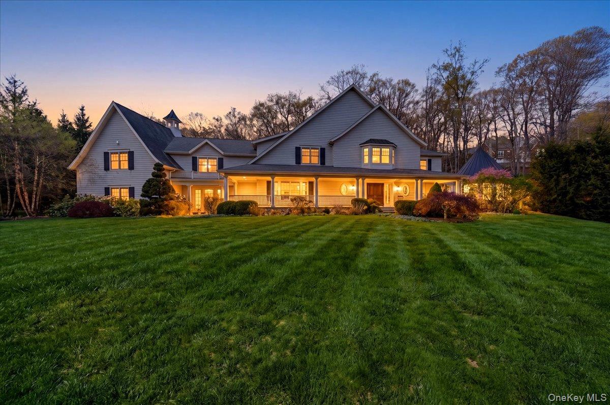 Welcome to 7 Ridgeview Circle — where luxury and thoughtful design come together on a secluded 2-acre cul-de-sac, in one of Armonk’s most desirable locations! A bluestone walkway leads to a covered front porch with built-in heaters, setting the tone for what’s inside. The grand foyer opens to a spacious and bright layout, leading you to the chef’s kitchen, featuring an oversized island, 6-burner Wolf range, Sub-Zero refrigerator, dual dishwashers, and a walk-in pantry. A formal dining room with butler’s area flows seamlessly into the family room with coffered ceilings and a dual-sided wood-burning fireplace, opening to a covered outdoor sitting area through French doors. A formal living room and sunroom overlook the private, landscaped grounds. The main level is complete with a mudroom, laundry room, and access to a 4-car garage. Upstairs, the primary suite offers a gas fireplace and private terrace, along with a spa-like bath featuring a soaking tub, walk-in shower, double vanity, and expansive dual walk-in closets. Three additional en-suite bedrooms and a massive bonus room with vaulted ceilings, powder room and second laundry, completes the 2nd floor. The lower level is built for entertaining, with a spacious recreation area, wet bar, home theater, fitness room with sauna and steam, and a 5th en-suite bonus room, ideal for a guest suite or au pair. Outside, enjoy a private backyard with in-ground pool, built-in BBQ, and professionally landscaped grounds with custom lighting—perfect for relaxing or entertaining. A home of this caliber was designed to impress and built to be enjoyed.