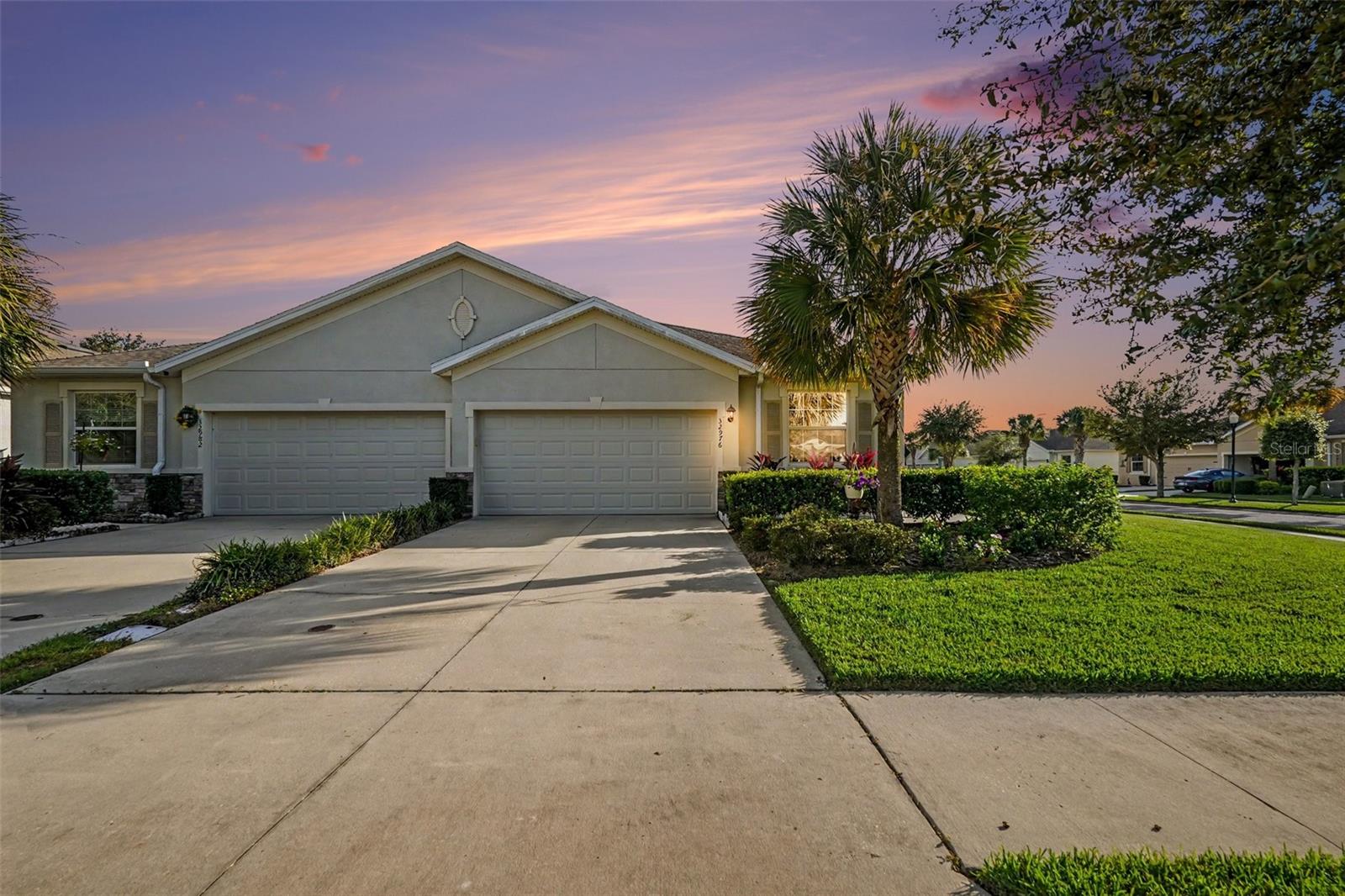 Virtually Staged. Experience the Florida lifestyle in WaterGrass, a beautifully landscaped, master-planned community in Wesley Chapel where resort-style recreation and everyday convenience come together. This inviting Corner lot Villa welcomes you HOME with an open living area, abundant natural light all rooms have ceiling fans and recessed lighting. The kitchen featuring a center island, designer lighting, generous cabinetry. and a walk-in Pantry. The adjoining dining and gathering spaces offer a comfortable setting for entertaining or relaxing at home, while the screened lanai provides a peaceful spot to enjoy morning coffee or unwind after a day exploring Tampa Bay. Custom paint and design feature walls add to the overall bright aesthetic of the home. Two additional bedrooms are perfect for an additional den, home office or guests. A large 2 car garage provides ample storage options as well as a long driveway to accommodate guest parking. All in a maintenance free - landscape maintenance provided neighborhood.Beyond your front door, WaterGrass offers amenities that make staying active and connected part of everyday life. Spend sunny afternoons by the community’s resort-style pools, enjoy a refreshing swim or get your laps in before starting the day. Zero-entry features, splash areas and shaded poolside spaces add to the vacation-inspired atmosphere. The fitness center makes it easy to maintain your workout routine, while tennis, pickleball and basketball offer opportunities for friendly competition. The clubhouse and gathering spaces serve as places to connect with neighbors, enjoy community events and build lasting friendships.Explore neighborhood parks, playgrounds and walking paths woven throughout a setting of tree-lined streets, landscaped green spaces and natural wetlands. Promenade Park adds another destination for outdoor enjoyment with its pool, splash park, playground and separate dog parks for large and small dogs. Whether your ideal day includes a workout, a leisurely walk, time at the playground or an afternoon poolside, WaterGrass offers plenty of ways to enjoy the outdoors.Conveniently located near Wesley Chapel’s expanding selection of shopping, dining and entertainment, the community puts everyday essentials and weekend outings within reach. Explore The Shops at Wiregrass, Tampa Premium Outlets and The Grove, with restaurants, boutiques and entertainment options throughout the surrounding area. Access to I-75 connects you to downtown Tampa, the Tampa Riverwalk, professional sports, concerts, cultural attractions and Tampa International Airport (TPA). For a change of scenery, plan a day exploring the Tampa Bay area’s Gulf beaches, waterfront dining and spectacular sunsets.Discover a home and community that bring together comfortable living, abundant recreation and access to everything the Tampa Bay region has to offer.