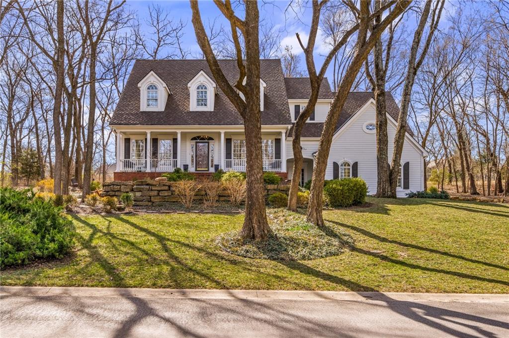 Located in the prestigious Cedar Creek subdivision, this Southern-style Colonial offers a rare blend of stately architecture and serence, natural beauty. From its commanding curb appeal to its prime position on Shadow Glen golf course, this home is a true sanctuary. Just across the street, you will find the entrance to the community's extensive lake trail system, perfect for sunset walks along Shadow Lake or morning jogs through the limestone bluffs. A massive, deep set front porch stretches across the facade offering the perfect spot for morning coffee. Beyond the grand formal entrance, a charming secondary "friends door" provides a warm informal welcome for close guests, adding the home's approachable character. This custom design by Kirk Cornelius offers a dramatic great room with a wall of windows designed to frame the manicured golf course views. A dramatic split staircase serves as the home's centerpiece, providing a formal focal point from the foyer while offering convenient dual access to the upper levels. The Primary Suite is a true retreat occupying its own dedicated level for ultimate seclusion. The lower level is designed for high-end entertaining and wellness. With a custom walk-behind wet bar with ample space for a full beverage service. There is a versatile space designed for a home gym. The walk-up design provides easy, direct access to the backyard.Beyond the finished living areas, this level provides abundant unfinished storage, ensuring a place for everything- from seasonal decor to golf gear. Located immediately next door to a beautifully maintained HOA park, providing expanded green space and a 'built-in" backyard extension without maintenance. The exterior Hardie Board siding captures the look of traditional wood. The 3 car side entry garage is heated & lots of storage. This fantastic subdivsion offers 3 pools, clubhouse, workout area, pickle ball, tennis, 65 acre lake, boat dock, trails, and community activities year-round.
