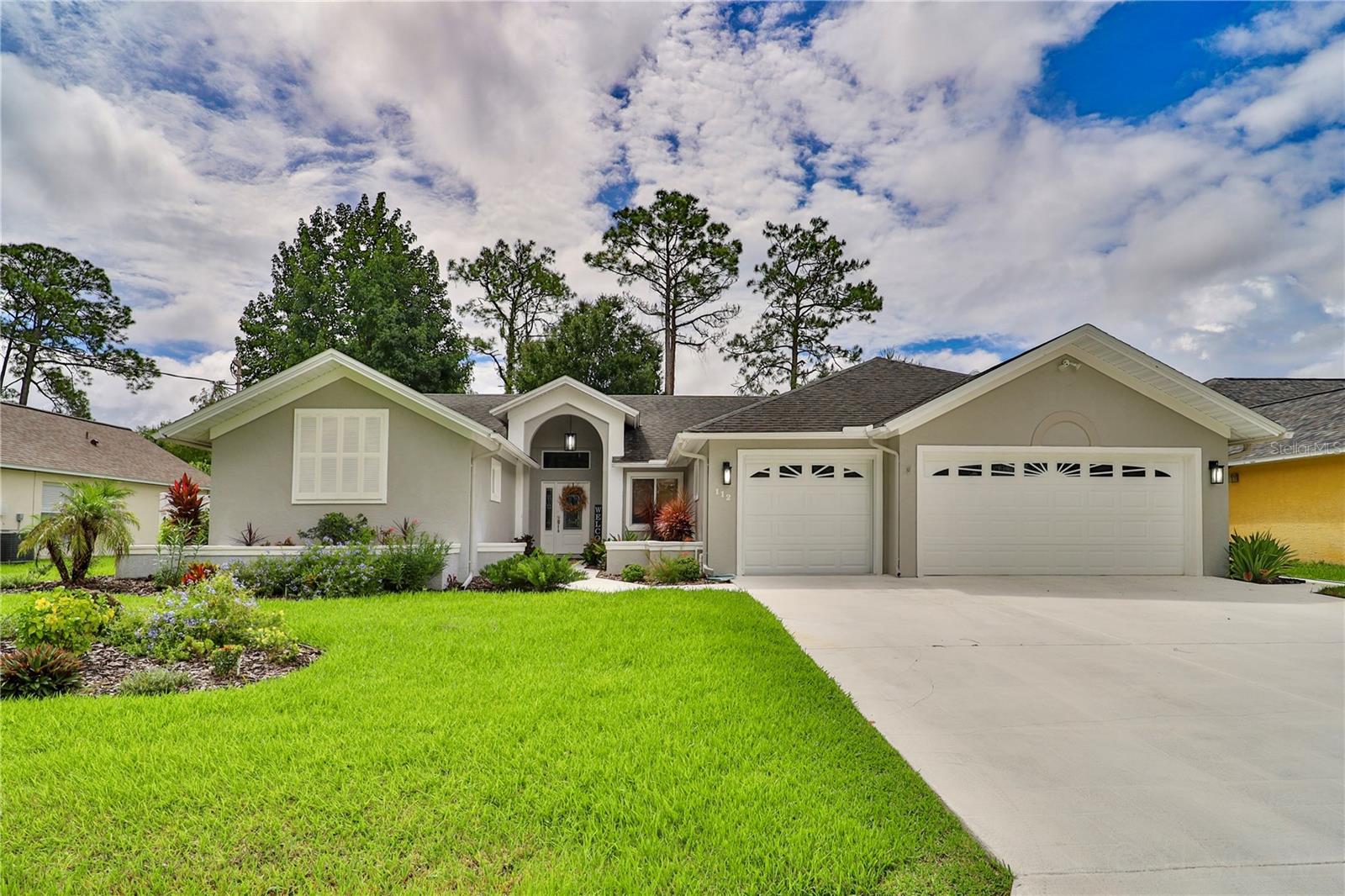Step inside this beautifully maintained Palm Coast Pool home, offering over 2100 square feet of comfortable living space. Th bright open layout features cathedral ceilings, all updates within the last five years, including new flooring, new lighting, and appliances, recent updates are a new well for irrigation, new whole house water treatment by Culligan, The spacious kitchen is fully equipped and family room boasts a cozy electric fireplace, family room leads to the Pool and outdoor living. Retreat to the main-floor primary suite, complimented by 2 additional bedrooms for flexibility, this house sets on a fully landscaped lot with mature plantings.Enjoy peace of mind with a 3 car garage and a prime location near Flagler Beach, shopping and dining.