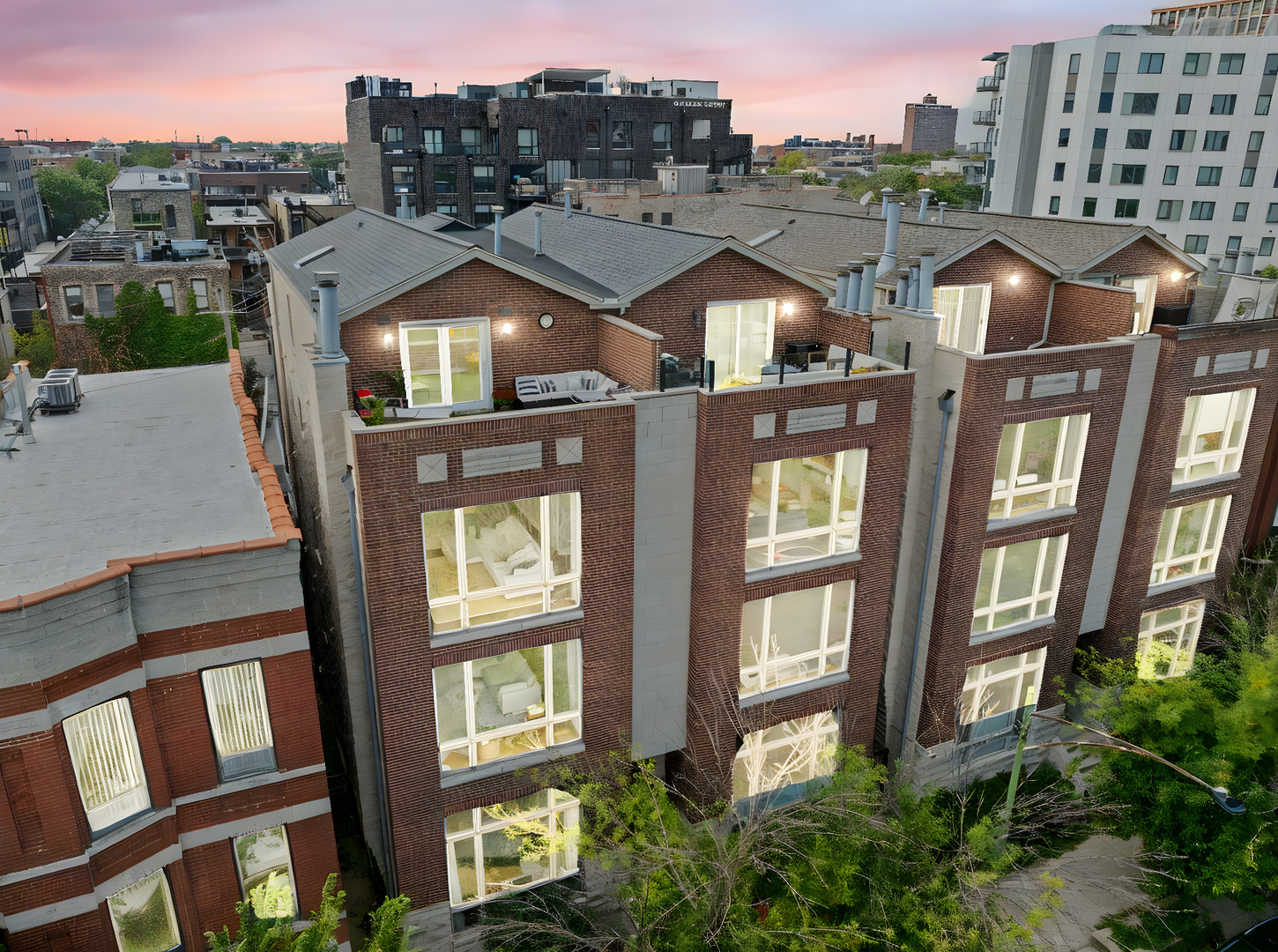 Expansive duplex penthouse with three private outdoor spaces and sweeping skyline views at the crossroads of West Loop, River West, and West Town. Featuring a designer-renovated primary bath, updated chef's kitchen, and garage parking, this home blends modern comfort with city convenience. Inside, soaring ceilings and oversized windows fill the open-concept living area with natural light and skyline views. The chef's kitchen and adjoining living space were thoughtfully updated for both entertaining and everyday living. The primary suite is a true retreat, anchored by a $35,000 professionally designed bath with double vanity, soaking tub, walk-in shower, heated floors and floor-to-ceiling Carrara marble, plus a custom California Closets walk-in. Enjoy three private outdoor areas, including a main deck facing the city-perfect for morning coffee, summer evenings, or weekend gatherings. Additional bedrooms offer flexibility for guests, an office, or fitness space, while the second-floor den can easily convert to a third bedroom. Steps from Chicago's premier dining, shopping, nightlife, and transit, 616 N May #3C delivers designer style, rare outdoor living, and an unbeatable location-a one-of-a-kind opportunity to experience the best of city living.