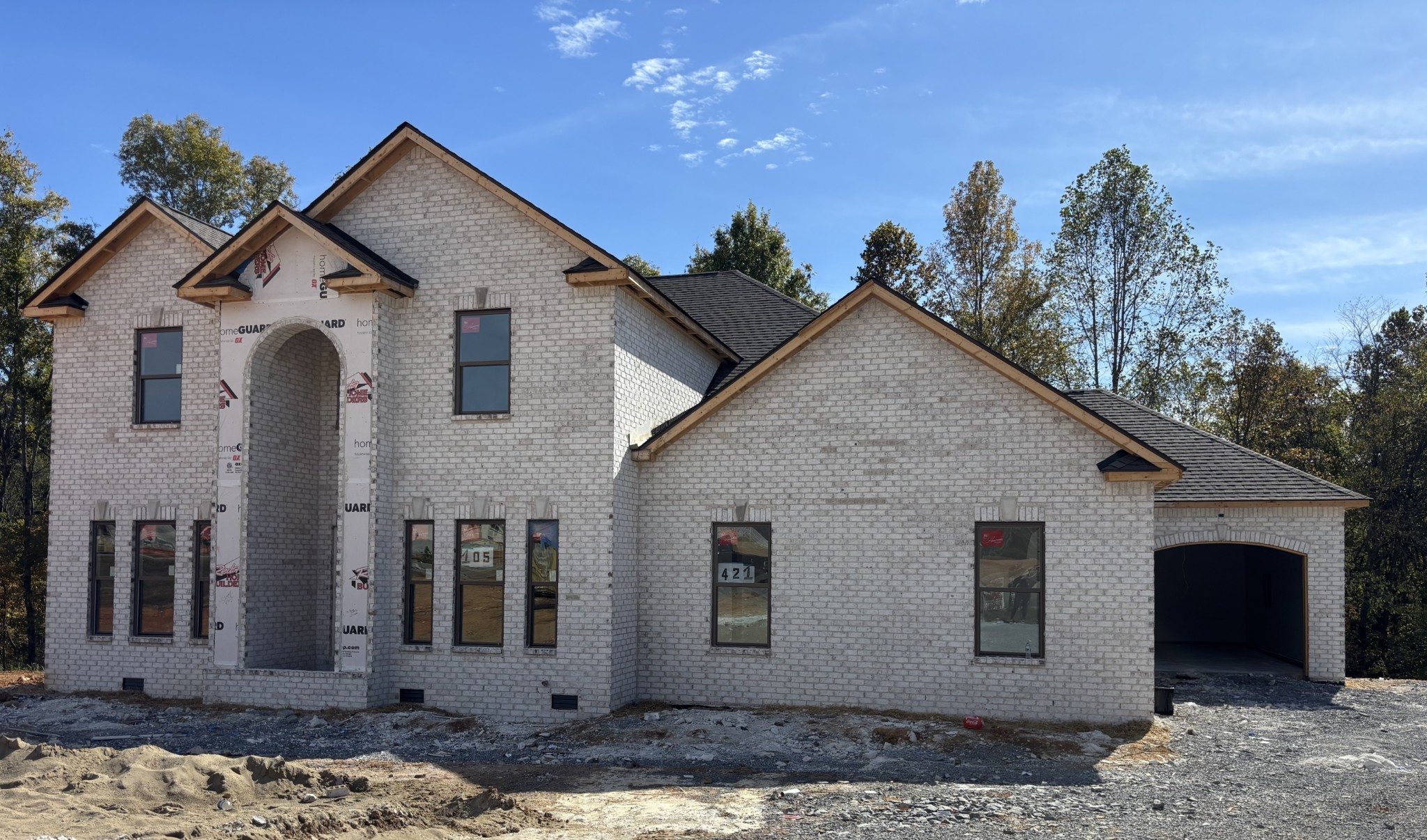 Seller is offering $22,017 in concessions!! Welcome to luxury living!! This exquisite 5-bedroom, 4-bathroom estate boasts an elegant blend of modern sophistication and timeless design, offering both comfort and grandeur for the most discerning homeowner. From the moment you arrive, you’ll be captivated by the home’s full-brick exterior, and upscale curb appeal. Step inside to be greeted by a grand foyer with soaring ceilings, statement lighting, and an open, airy layout that instantly feels like home. The main level is thoughtfully designed for both everyday living and elegant entertaining. You’ll find a formal dining room perfect for hosting, and a private study tucked away for productivity and quiet retreat. The spacious living room features two-story ceilings, a stunning fireplace, and oversized windows that flood the space with natural light. At the heart of the home is the chef-inspired kitchen, complete with sleek built-in appliances including a cooktop, double ovens, in-cabinet microwave, and an oversized quartz island ideal for gathering. A walk-in pantry and cozy breakfast nook round out this perfect culinary space, while minimalistic gold light fixtures and designer finishes elevate the overall aesthetic. The main-level primary suite is a true private retreat, featuring a spa-like en suite bathroom with dual vanities, a soaking tub, and a luxurious cave-style tiled shower and an elaborate dressing room. Also on the main floor is a well-appointed guest bedroom with full bath, and an impressive 11-foot laundry room with space and function. Upstairs, the home continues to impress with a private guest suite and full bath, two additional bedrooms with shared full bath, and a generous bonus room—ideal for a home theater, gym, playroom or anything you can dream Step outside and imagine your life in this serene community-- Quick access to I-24 and easy drive to and from music city!