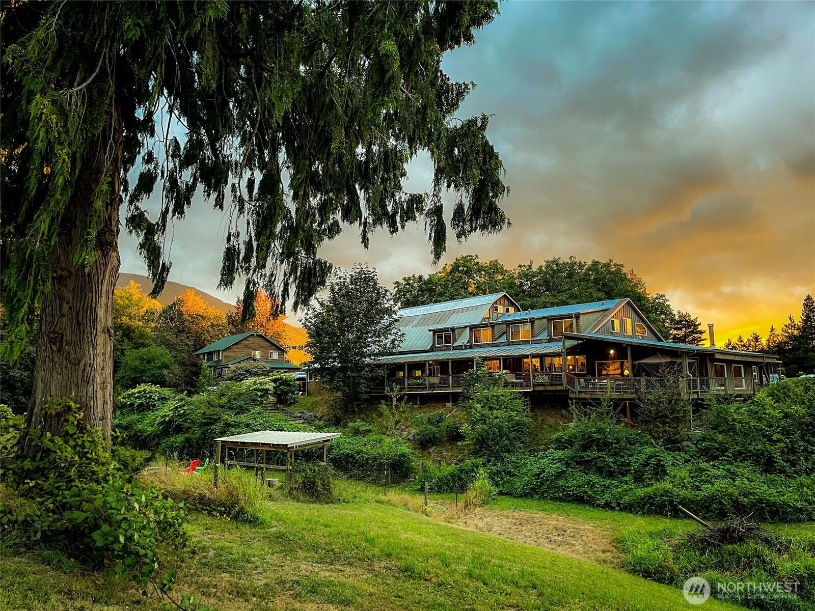 Cedar Springs Lodge...45+ Acres, 6,000 sq ft, 37 X 46 gathering room, spacious full kitchen, dining area, relaxing great room w/access to a full length covered deck overlooking the pastoral & mountain views. Sleeping areas on main & above. This extraordinary property offers natural beauty, peaceful surroundings & is an actively established venue. The main home with its wrap-around porch provides a peaceful retreat for owner/operator. More than just a venue & home, it's a legacy property w/multiple possibilities. Seclusion & accessibility, the estate presents both immediate revenue & long-term lifestyle value. Located in beautiful Skagit Valley, a 90 minute drive from Seattle or Vancouver, BC.