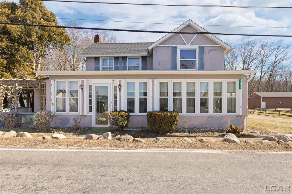 This charming lake cottage, originally built in 1900, offers a wonderful opportunity to create the lakeside retreat of your dreams. Full of character and history, the home is ready for updates and your personal touches. The property also includes a separate guest home. With its peaceful lake setting and flexible possibilities, this home is perfect if your ready  to have fun on a all sports lake, make memories and create the home of your dreams. *Chandelier in dining is excluded. Appliances in guest house included*