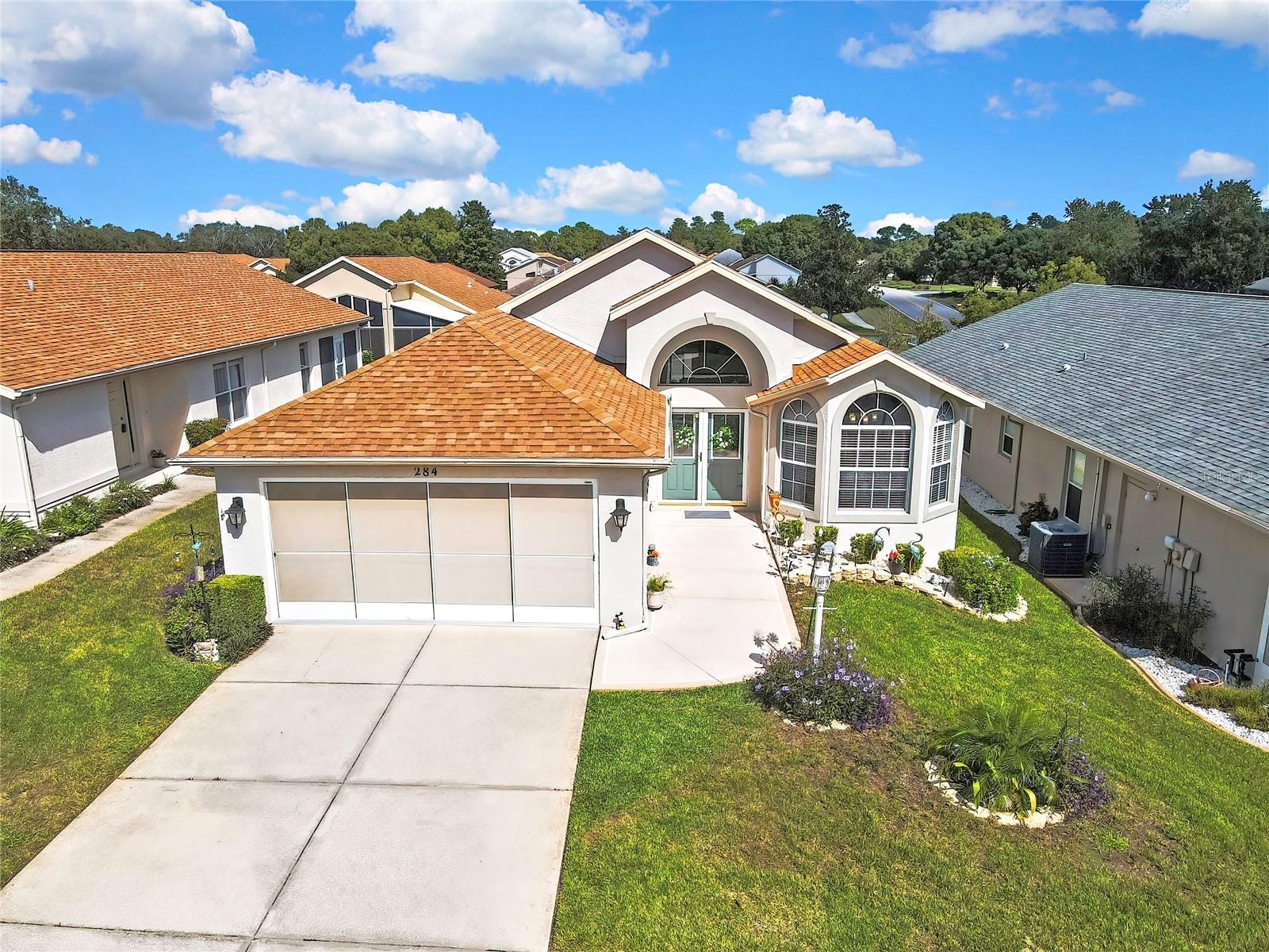 Welcome to the Florida lifestyle you’ve been dreaming of in the highly desirable Wellington at Seven Hills, one of Hernando County’s premier 55+ guard-gated communities! This beautifully maintained 3-bedroom, 2-bathroom home offers the perfect combination of comfort, elegance, and low-maintenance living. Step through the beautiful double-door entry into a bright, inviting interior featuring soaring vaulted ceilings, tile flooring throughout, and a spacious, welcoming layout designed for both everyday living and entertaining. The home features a separate dining room, perfect for hosting family gatherings, holiday dinners, or enjoying meals with friends. The spacious kitchen offers stainless steel appliances, ample cabinetry, a pantry, and a charming breakfast nook, while the inviting living room provides plenty of space to relax and unwind. The generous primary suite offers a relaxing private retreat with a walk-in closet, while two additional bedrooms provide flexibility for guests, hobbies, or a home office. Enjoy your morning coffee or unwind in the enclosed, screened lanai, then step outside to an additional outdoor paver deck in the backyard, offering the perfect space for relaxing, entertaining guests, or simply enjoying Florida’s beautiful weather. Additional highlights include a 2018 roof and 2021 A/C. Wellington at Seven Hills offers a wonderful resort-style lifestyle with a clubhouse, swimming pool, fitness center, tennis courts, social activities, and more. Conveniently located near shopping, restaurants, medical facilities, and the Suncoast Parkway, this home offers the perfect balance of peaceful community living and everyday convenience.  All information, including HOA Whether you’re looking for a full-time Florida residence or a seasonal retreat, this is your opportunity to enjoy the lifestyle you deserve. Schedule your private showing today! Priced to sell. All information including HOA, to be verified by buyer or the buyer's agent.