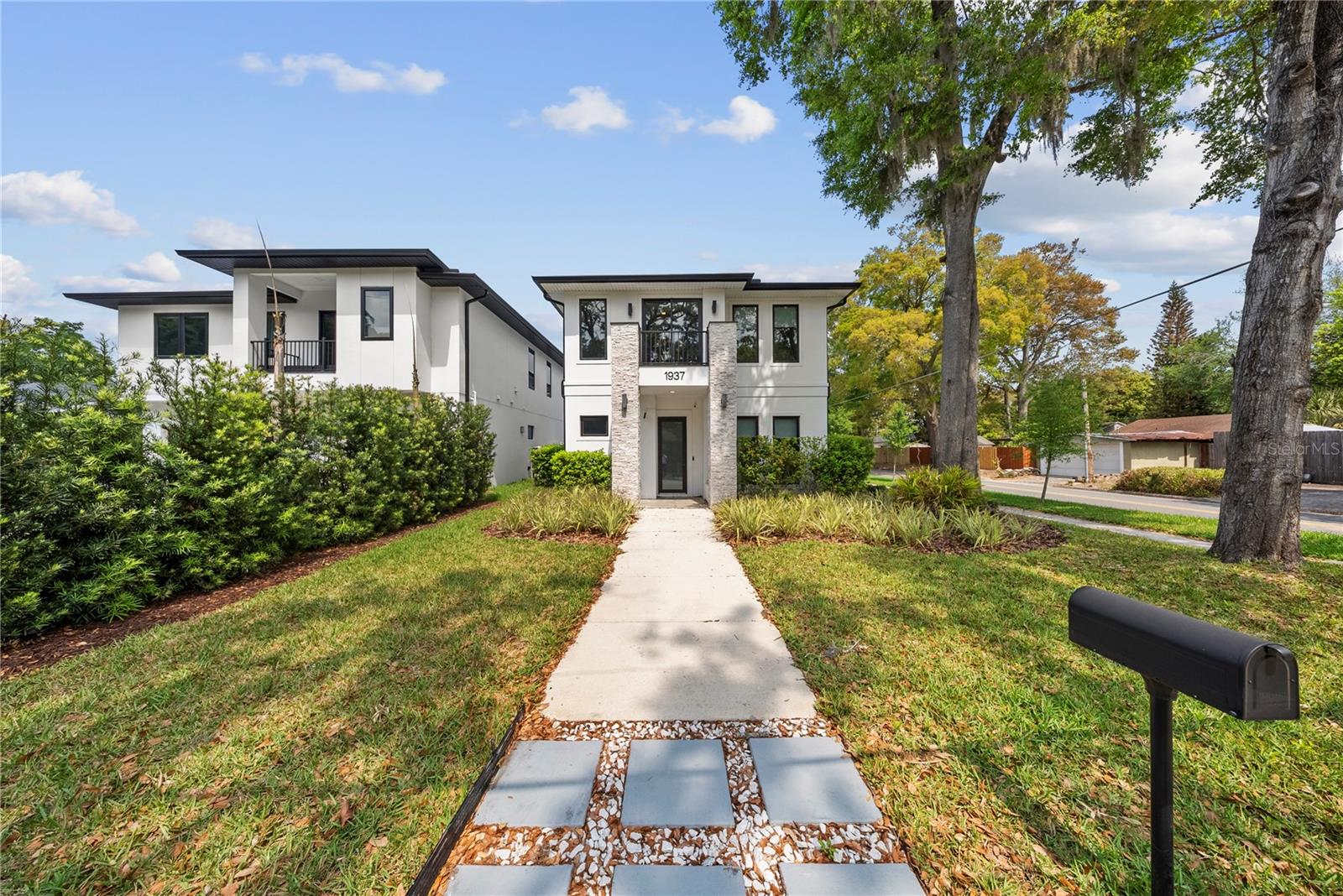 This modern new construction in a prime Orlando location is just moments from Winter Park, Audubon Park and Downtown Orlando. Positioned on a desirable corner lot within an established neighborhood with A-rated schools, this residence offers a refined balance of design, comfort and location. Featuring four-bedrooms and four-baths across approximately 2,788 square feet, the home showcases a clean, open layout with well-defined living spaces, abundant natural light and a seamless indoor flow. A distinctive highlight is the garage, thoughtfully equipped with ceiling lighting and air conditioning, offering flexibility for a variety of uses beyond traditional parking. This is a well-positioned property for those seeking privacy, quality, and proximity to some of Orlando's most desirable areas.