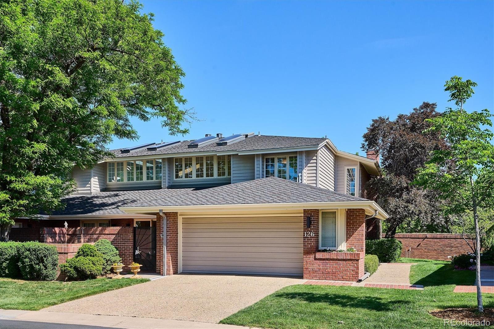 Welcome to one of the sunniest homes in Polo Club North, where privacy, elegance, and effortless living come together in a beautifully refreshed, move-in-ready residence. Bathed in natural light from expansive windows, soaring ceilings, skylights, and coveted southeastern exposure, this exceptional home showcases gleaming hardwood floors and timeless style. Gracious living and dining spaces flow seamlessly into the updated kitchen and inviting family room, creating an ideal setting for everyday living and entertaining. The formal dining room features a dramatic vaulted ceiling, while the spacious living room offers a gas fireplace and opens to a private patio for seamless indoor-outdoor living. A versatile office with built-in bookcases and a wet bar opens to the covered patio, while the family room enjoys access to a second outdoor retreat. Two private patios provide ideal spaces for morning coffee, outdoor dining, or evening gatherings. Fresh designer paint, main-floor laundry, and abundant storage add everyday convenience. Upstairs, the expansive primary suite offers a sitting area, balcony, large walk-in closet, and luxurious five-piece bath. A skylight fills the primary bathroom with natural light, highlighting the soaking tub, separate shower, and dual vanities. A spacious secondary bedroom and full bath complete the upper level. The finished basement provides exceptional flexibility with a large den, space for a guest bedroom, a 3/4 bath, and generous storage. Located within the prestigious gated Polo Club North community, residents enjoy 24-hour security, on-site management, lawn care, snow removal, and exterior maintenance. Community amenities include a clubhouse, indoor pool, fitness center, tennis and pickleball courts, and neighborhood social events. Just minutes from Cherry Creek's premier shopping and dining, this exceptional home offers luxury, comfort, privacy, and convenience in one of Denver's most sought-after communities.