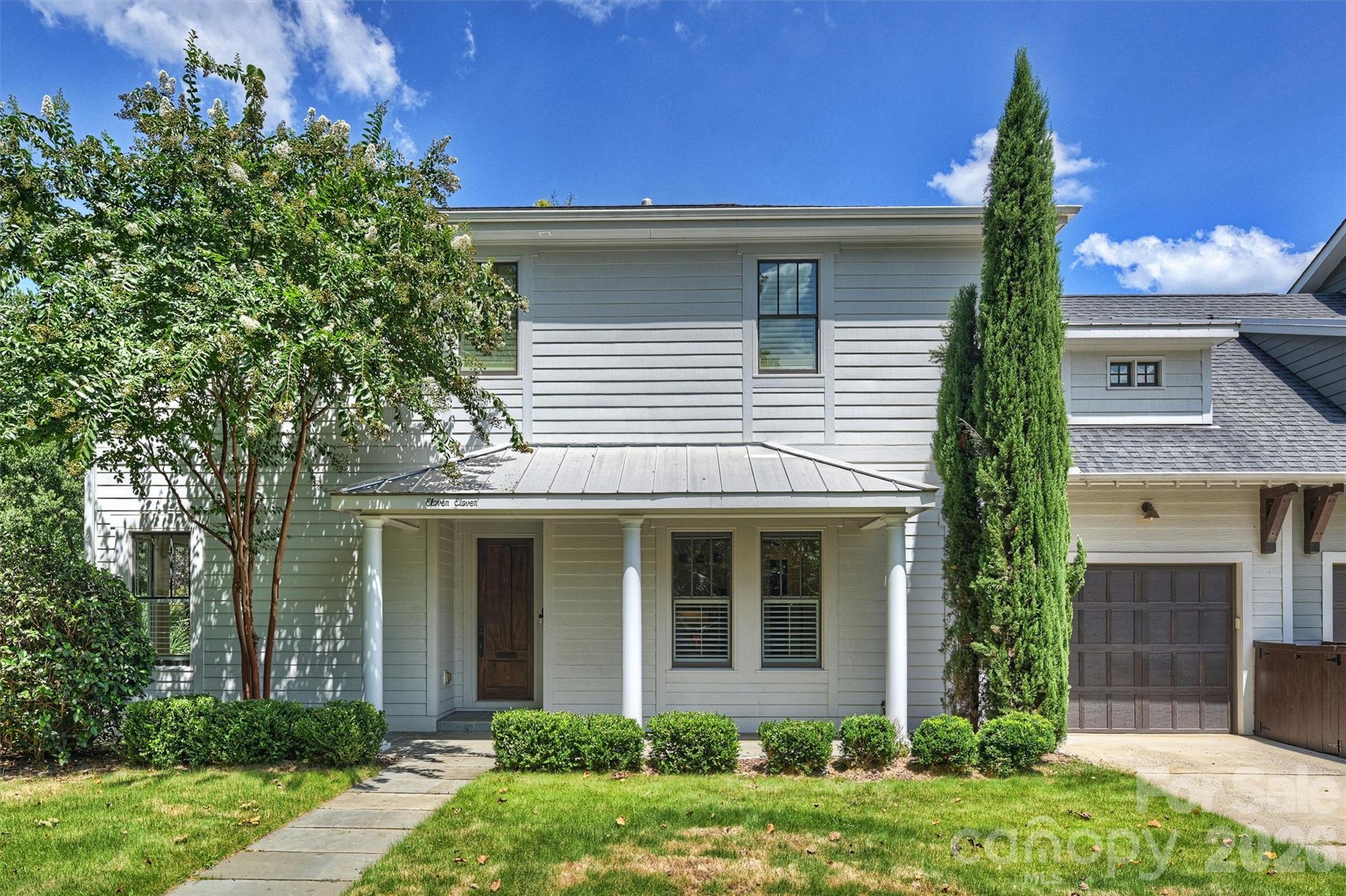 Welcome to 1111 Pierce Street, a rare columned Dilworth duet overlooking Latta Park and offering the privacy, scale, and amenities of a single-family residence. Being one of only five properties directly adjoining the park, this exceptional home delivers a truly uncommon combination of location, architecture, and effortless indoor and outdoor living. Impeccably maintained and custom built, the home welcomes you with an airy, open main level framed by 10-foot ceilings, generous windows, and beautifully appointed living spaces. The chef’s kitchen is both refined and functional, featuring custom cabinetry, a substantial quartz island, 36-inch gas range with griddle and pot filler, stainless refrigerator, and double ovens. The kitchen flows naturally to the dining, living, and sitting rooms, creating an ideal setting for both everyday living and entertaining family and friends. Beyond the expansive doors, a private turfed backyard becomes a personal retreat with a saltwater pool, bluestone terrace, exterior bath, and outdoor shower. With Latta Park just beyond the trees, the setting feels remarkably private while offering the beauty and openness of park-side living. Upstairs, three bedrooms, two full baths, and a versatile fourth bedroom or bonus room provide exceptional flexibility. The serene primary suite features a tray ceiling and Juliet balcony overlooking the pool and lush park landscape. Its beautifully appointed bath includes heated floors and a generous stone shower. White oak flooring extends throughout the home, complemented by wool carpeting in the bonus room and stone tile in the baths and laundry. Perfectly positioned for the best of Dilworth, with easy access to the Greenway, Midtown, South End, CMC, and the shops and restaurants of East Boulevard. A truly special opportunity to experience private, park-side living in the heart of Charlotte.